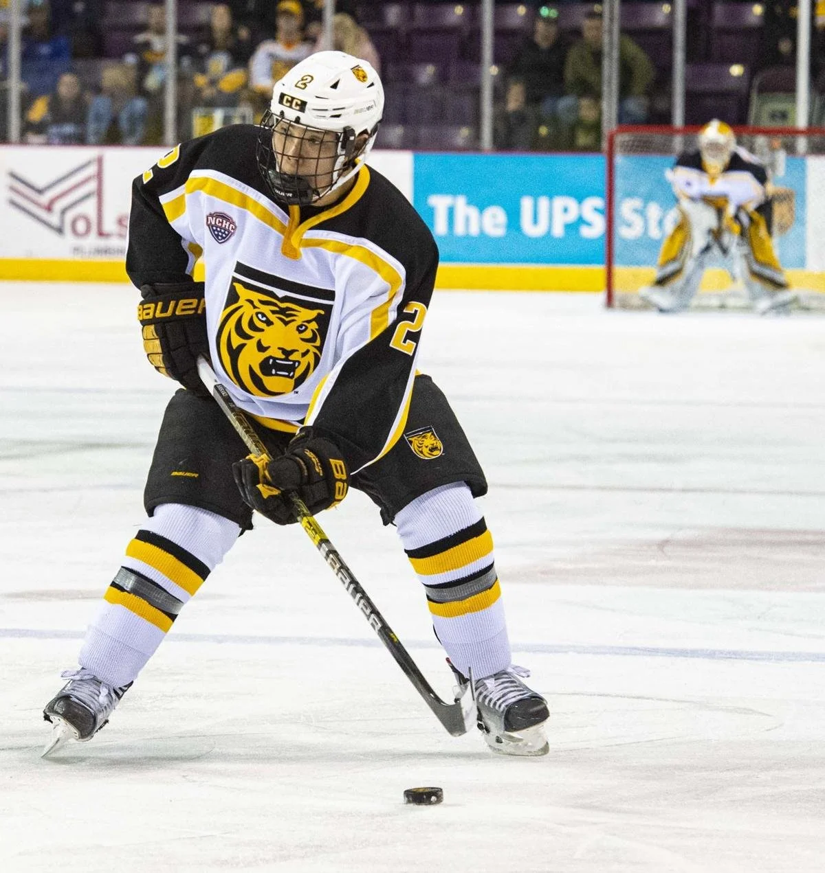 Chad playing collegiate hockey