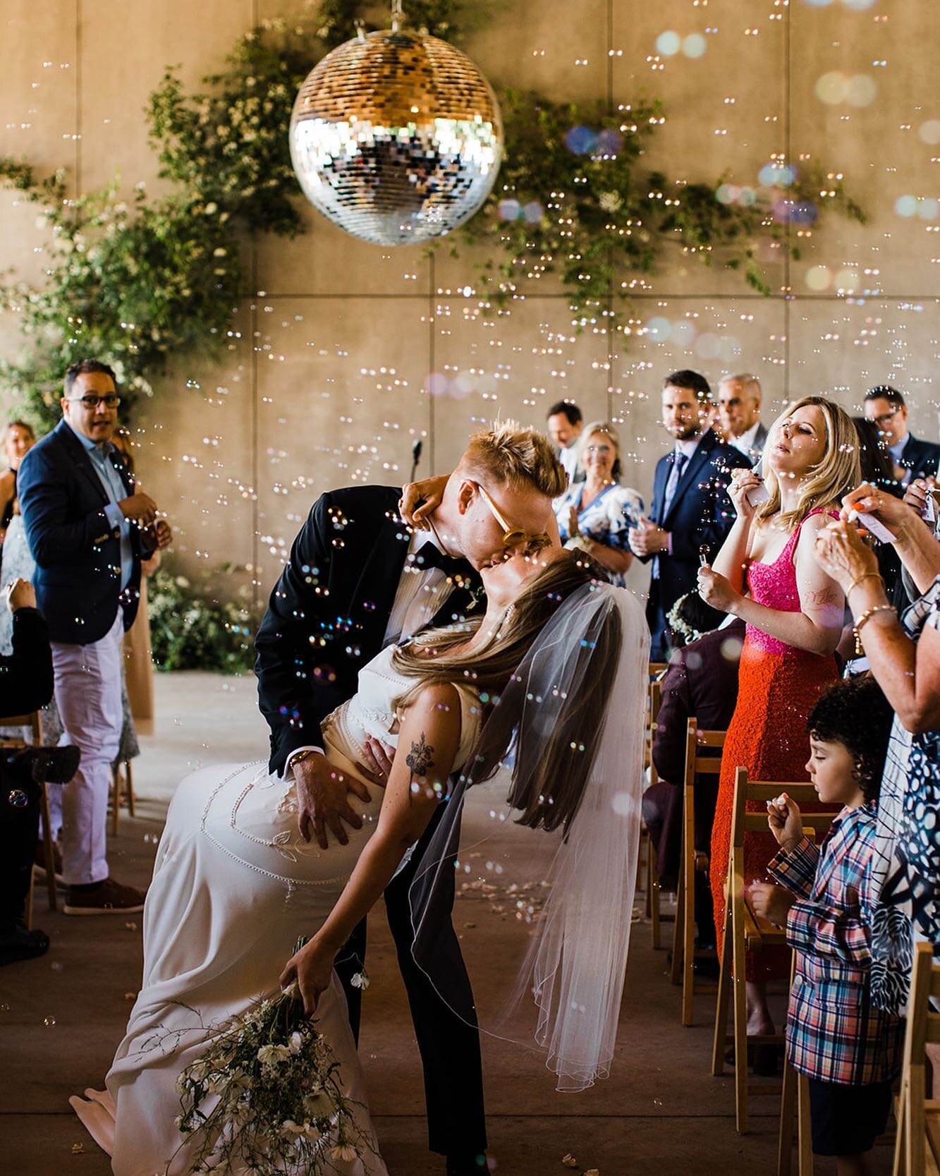 Get married beneath the disco ball to ensure your lives together stay groovy and full of shimmer 🎶💖 
Happy anniversary, Allison + Tom!!! 

Photo: @storyandgoldweddings 
Planning: @dawnmauberret 
Venue: @gathergreene 
Catering: @figandpigcatering 
F