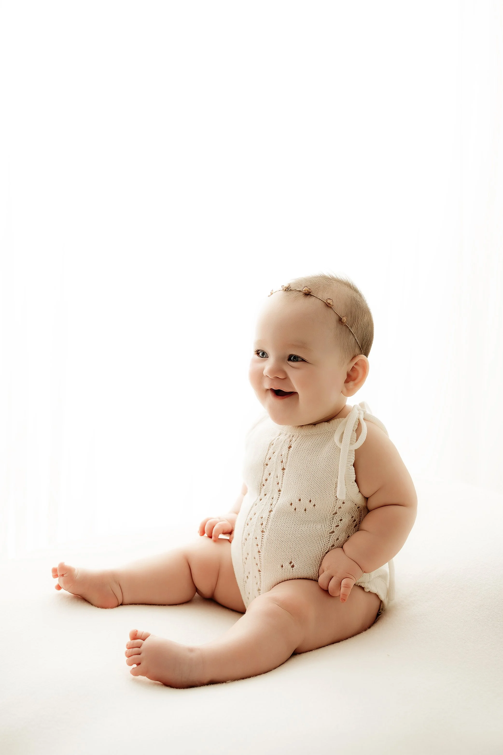 Brisbane baby milestone photographer capturing 6 month old sitting portrait in studio