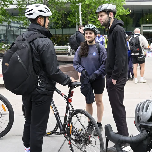 Three riders talking beside their bicycles at the Ride2Work breakfast