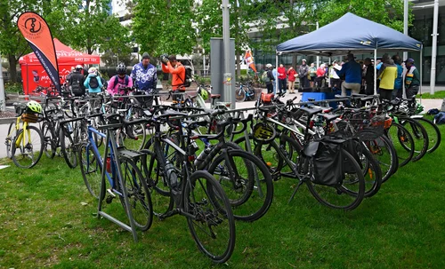 Bikes lined up beside event tents at Veterans Park for Ride2Work Day 2026