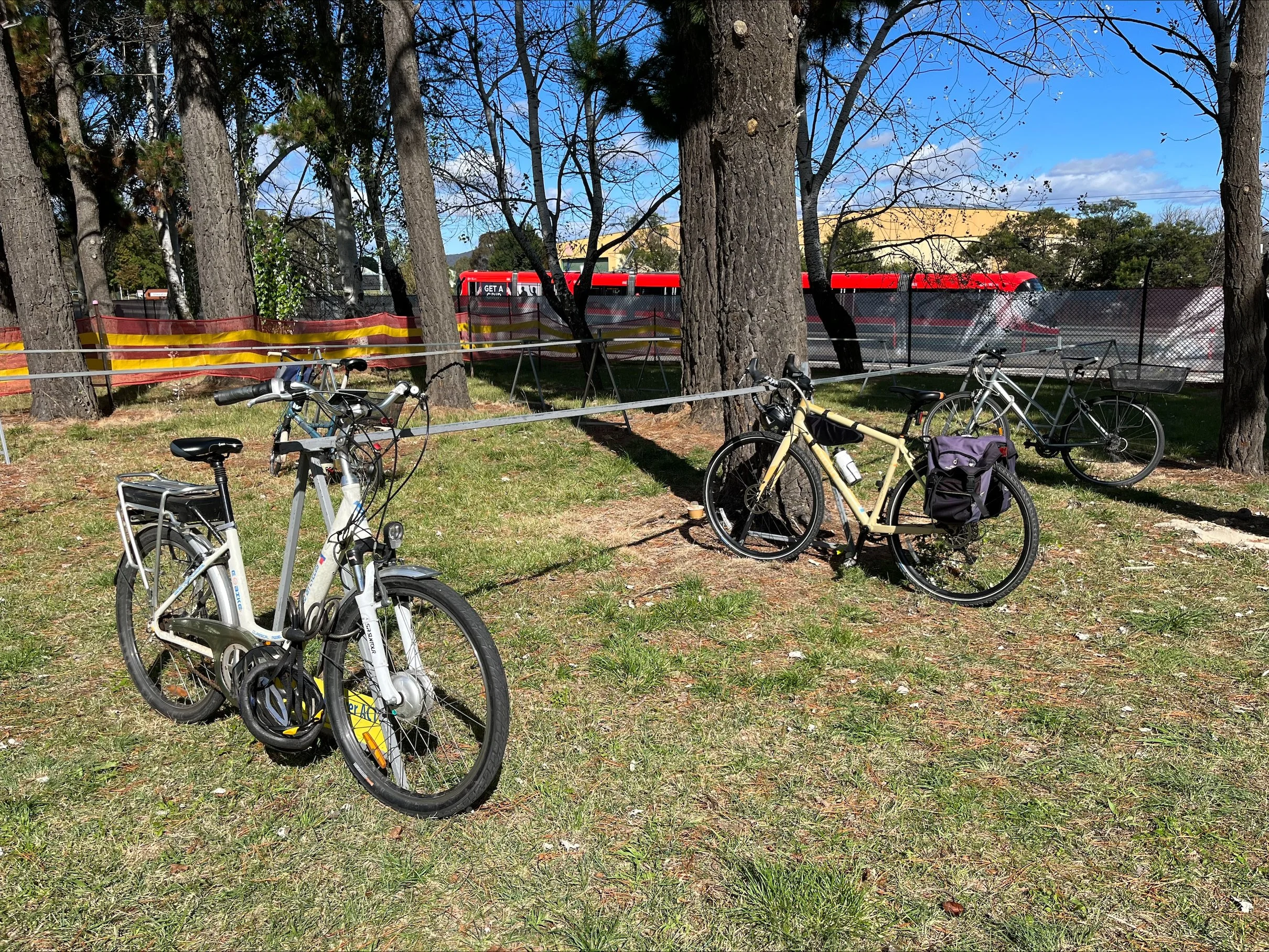 Bicycles parked securely in temporary Pedal Power bike racks at a Canberra event