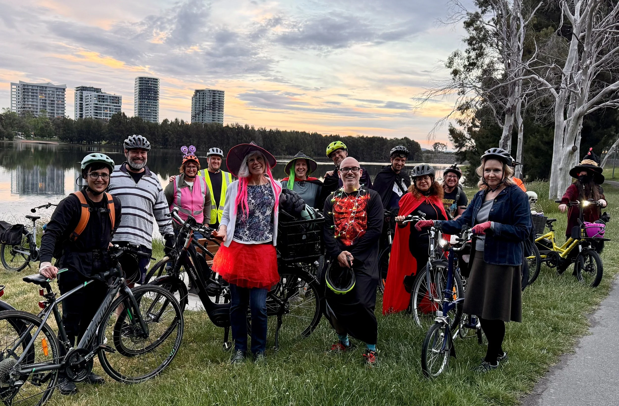 Community cyclists with their bikes beside Yerrabi Pond