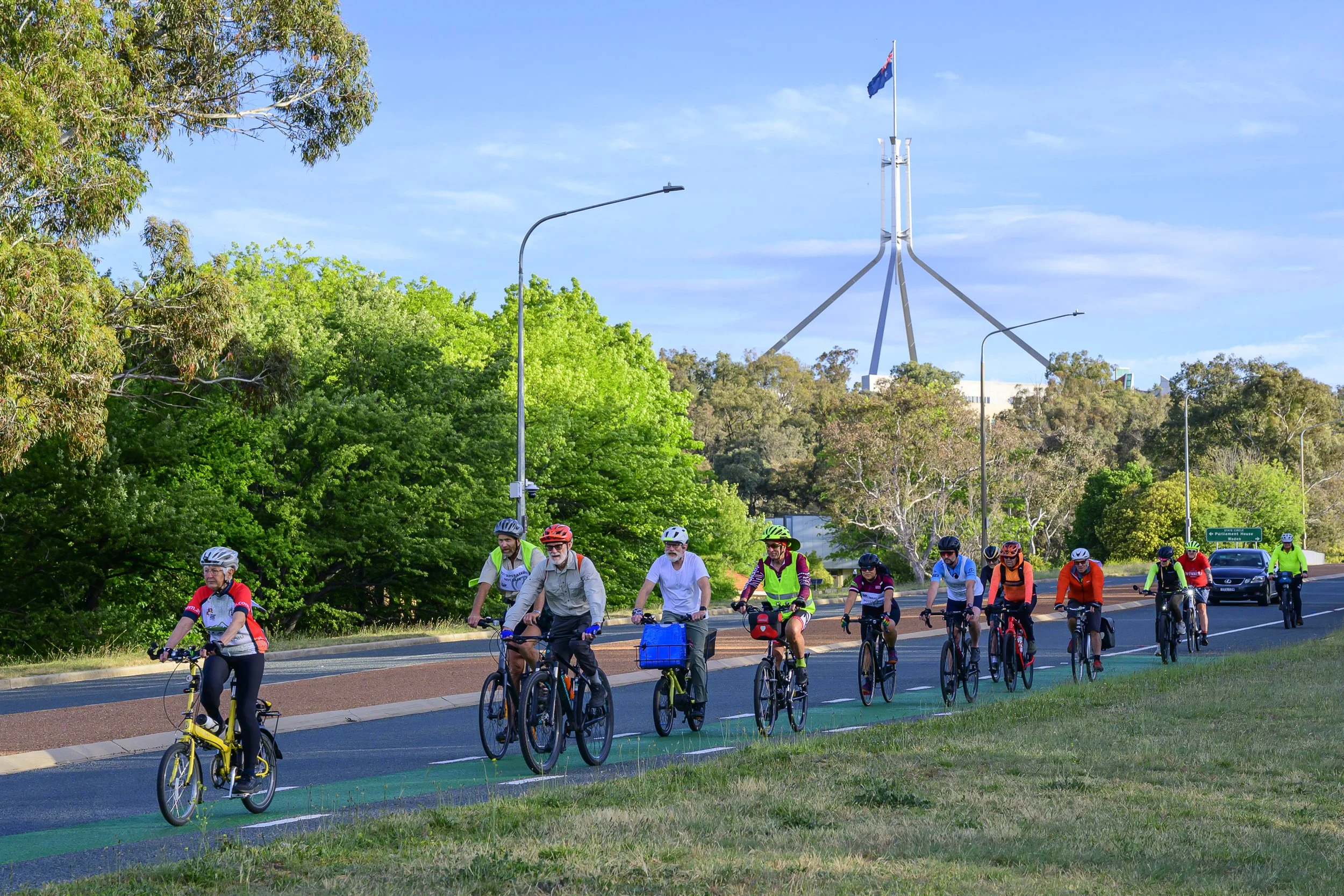 Pedal Power members riding together through Canberra