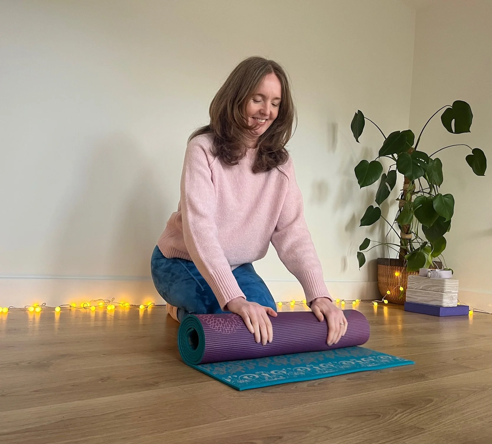 Tula Jo rolling a yoga mat