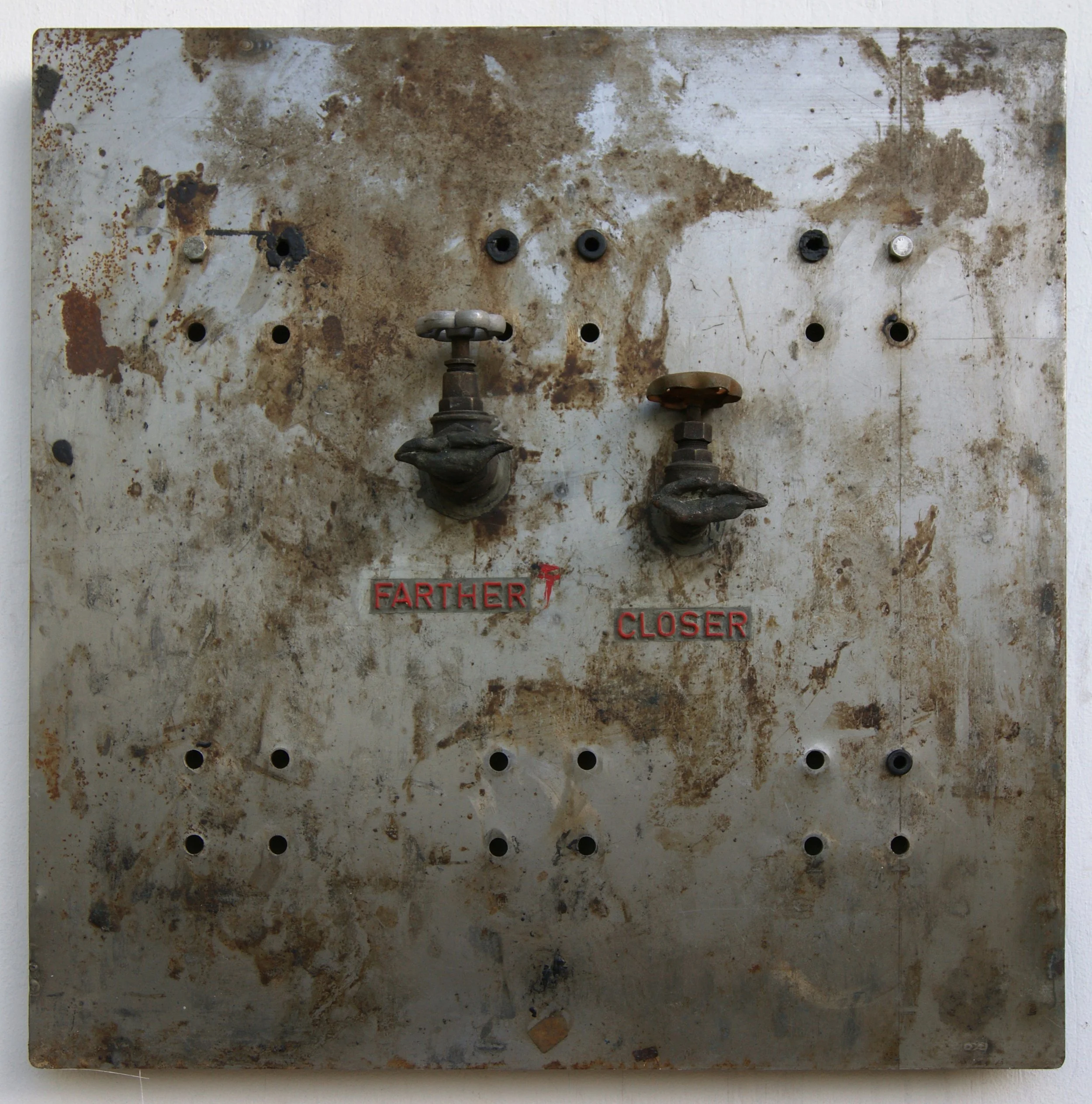 A convenient distance, 2019. Iron, bronze, water taps, letters, 60 x 60 x 13 cm.