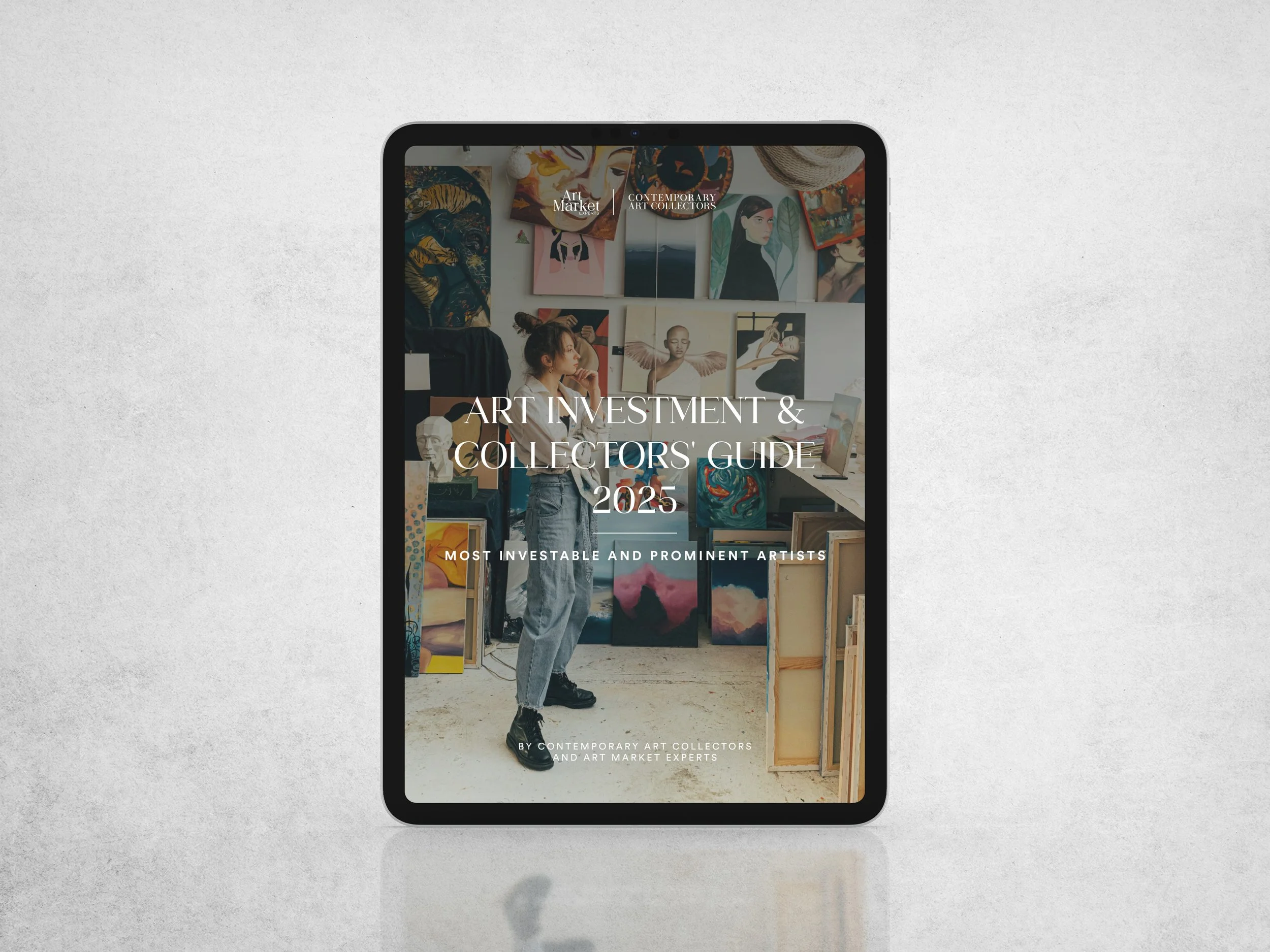 Tablet displaying a cover for "Art Investment & Collectors' Guide 2025" featuring a person in an art studio with various paintings and sculptures.