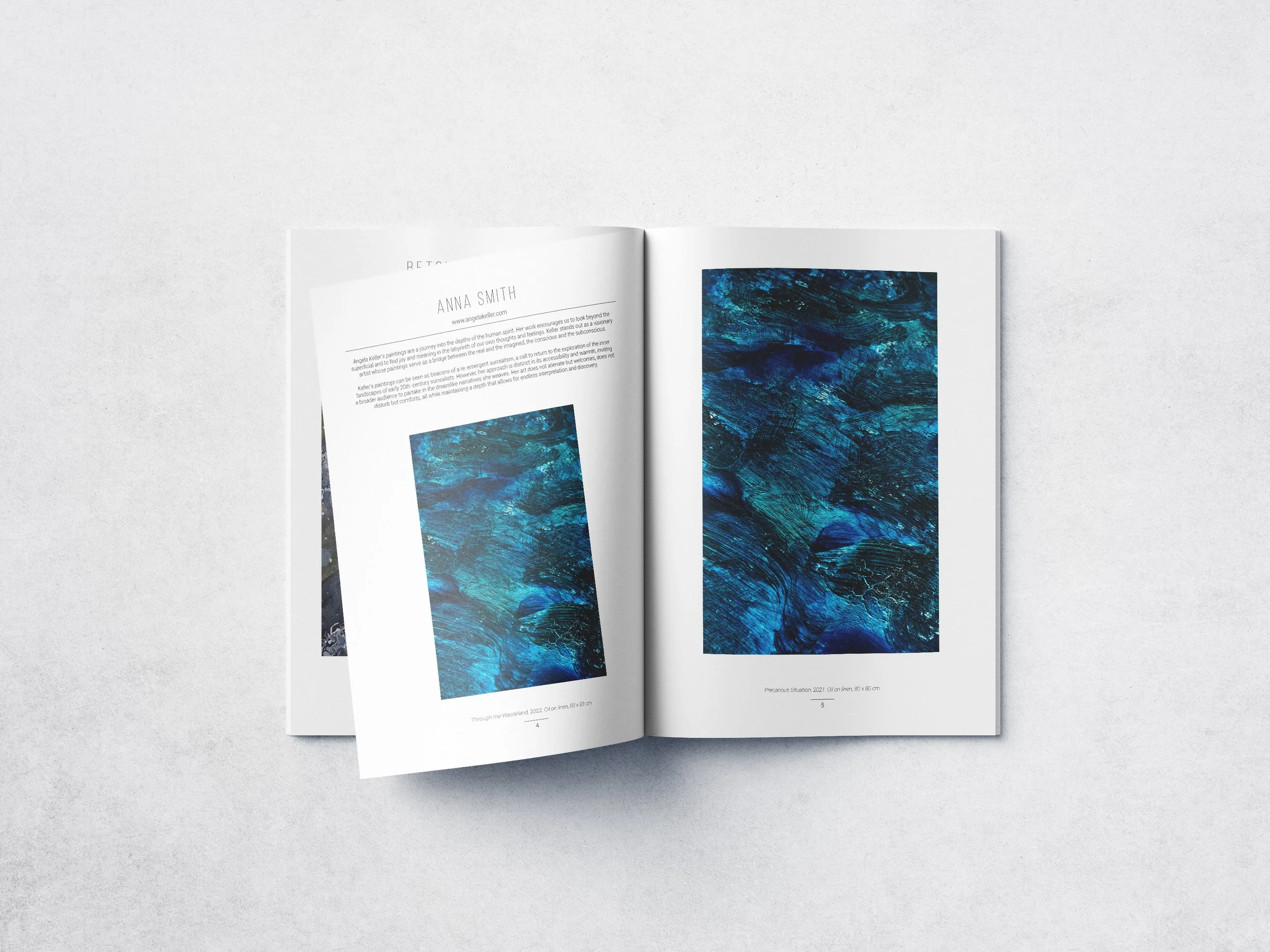 Open magazine with abstract blue artwork on pages