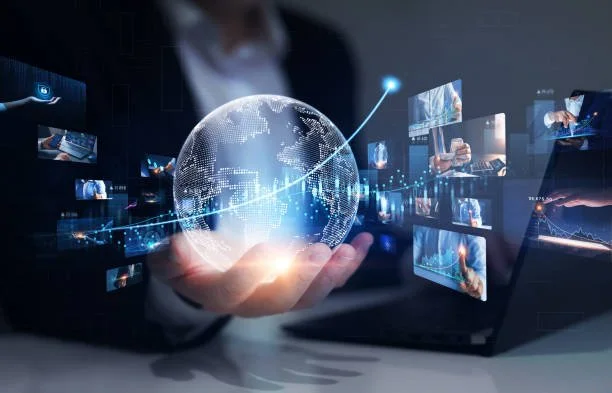 Person holding a glowing digital globe with data charts and futuristic screens around.