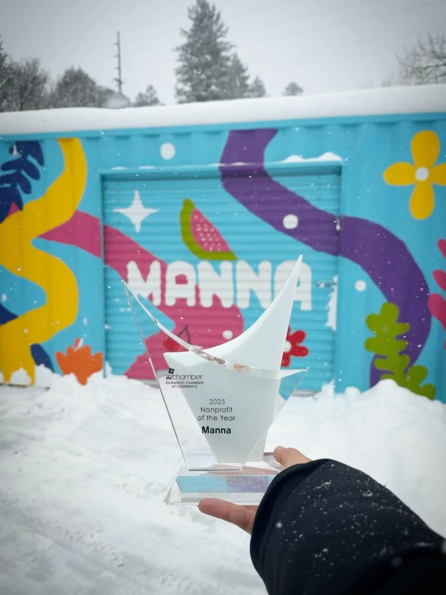 Yes, we are open today. Despite the snowfall, @mannadurango is serving hot meals until 1 PM, and our heated pavilion is ready with hot coffee and tea for anyone who needs a warm and welcoming space. Please drive or walk safely, and if you are able, t