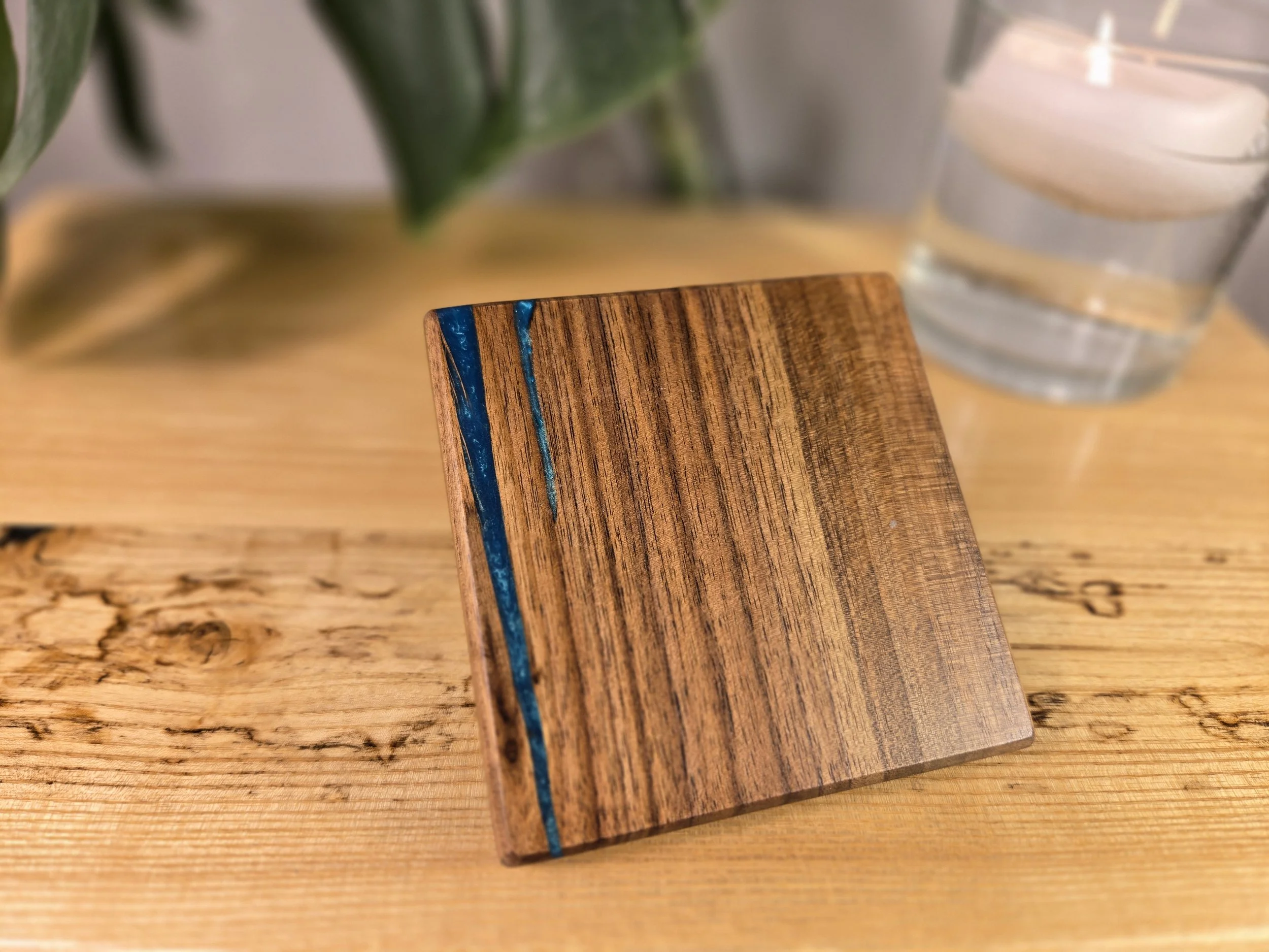 walnut coaster with turquoise blue iridescent epoxy.jpg