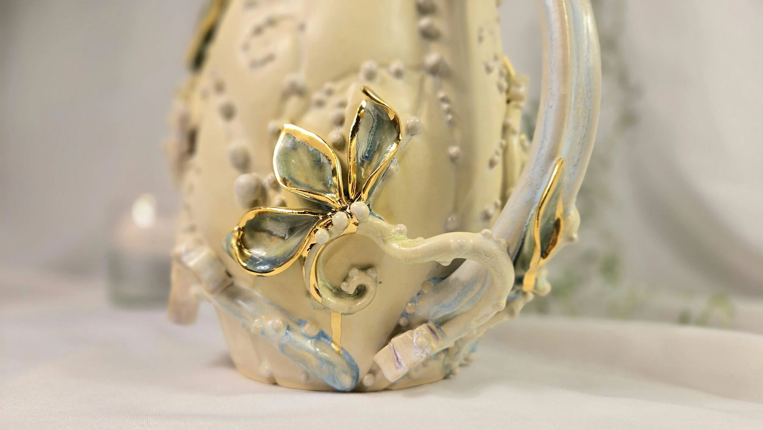 Tera Pitcher - alabaster, turquoise, hints of pinks, blues, greens, and pearl, with 22k yellow gold accents on white stoneware (8).jpg
