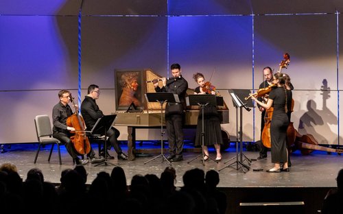 Performers playing on stage of Gretna Music's stage.