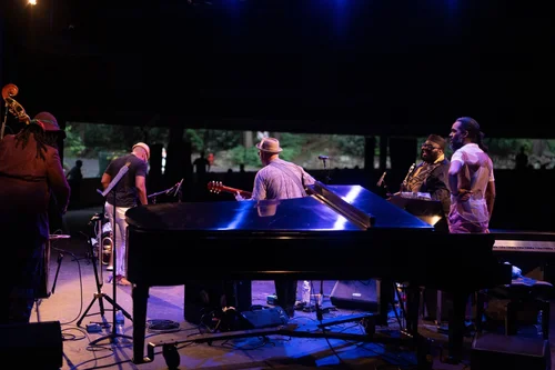 Performers playing on stage of Gretna Music's stage.