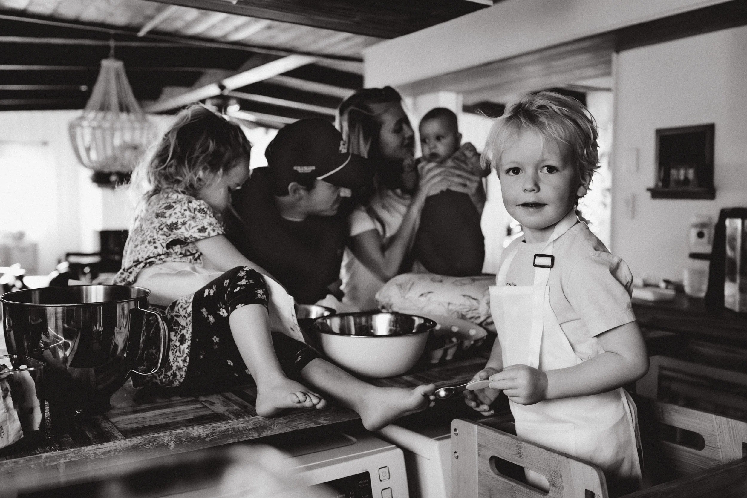 Family of five baking cookies together in their Boulder home during an indoor lifestyle photo session
