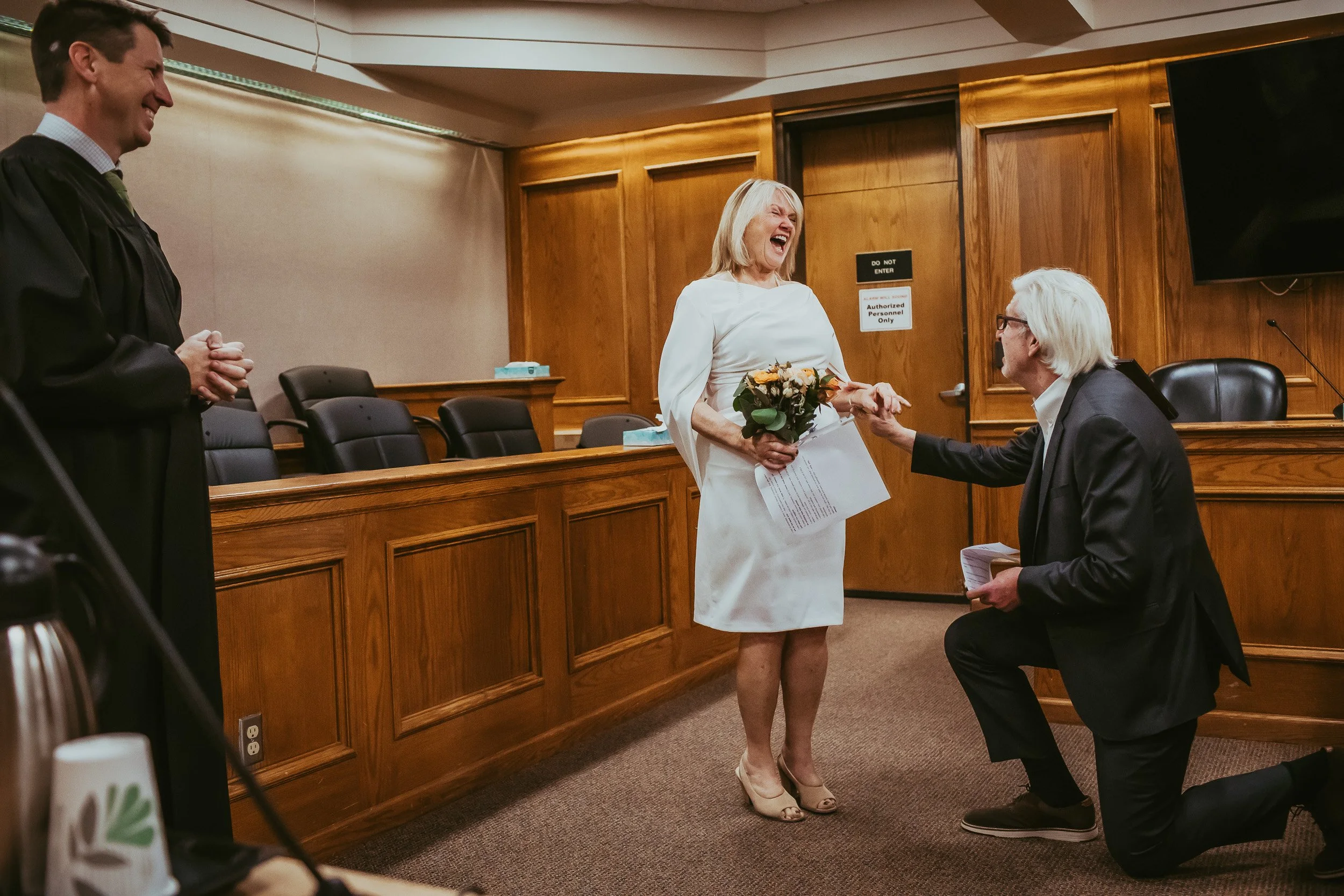 Mark proposing to Laurie during courthouse wedding in boulder, colorado