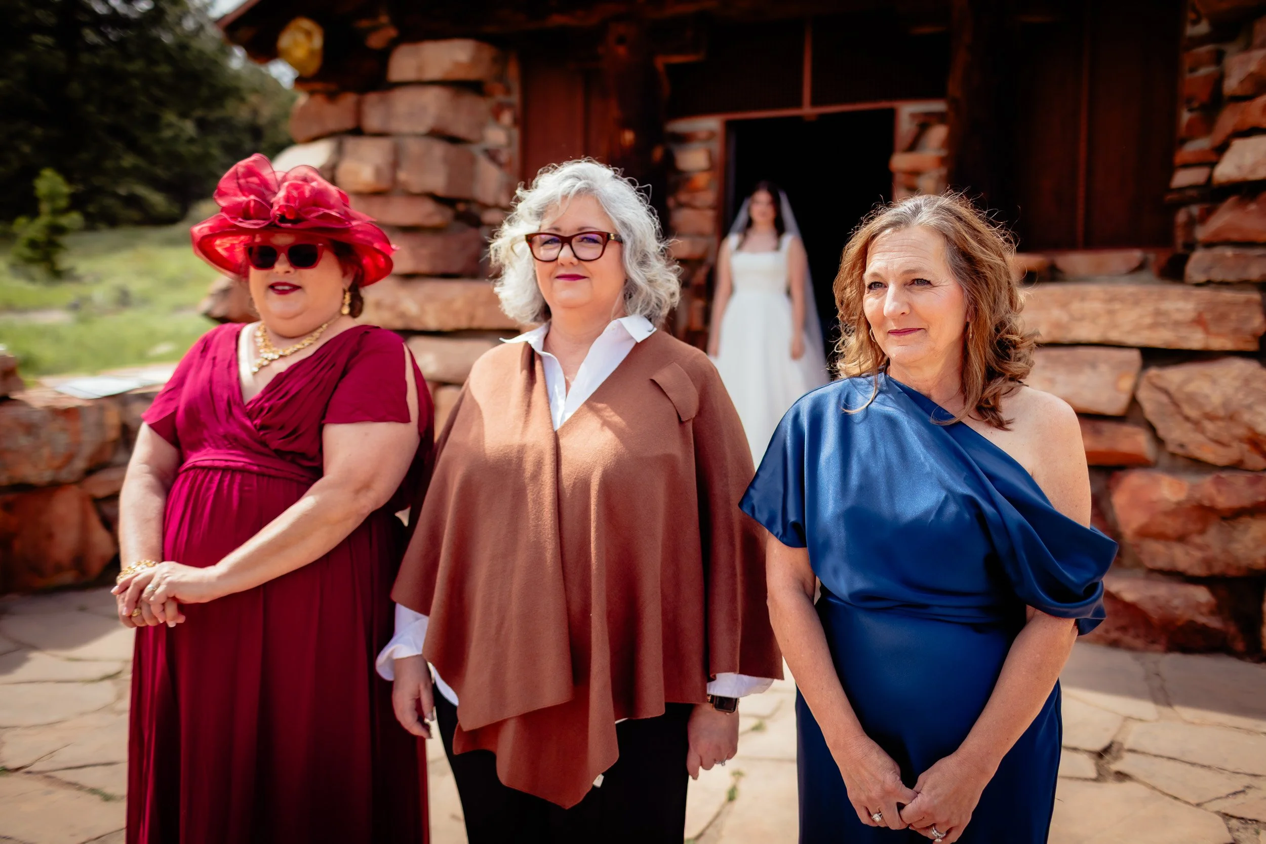 Bride showing her wedding dress to her parents before the ceremony