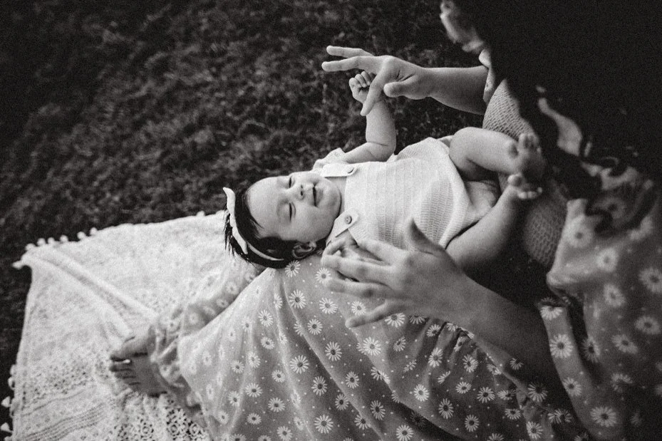 A whimsical family photoshoot at a charming greenhouse in Windsor, CO, during golden hour. This session beautifully blended warm, glowing light with lush greenery, capturing tender connections and playful moments—ideal for families who love unique, n