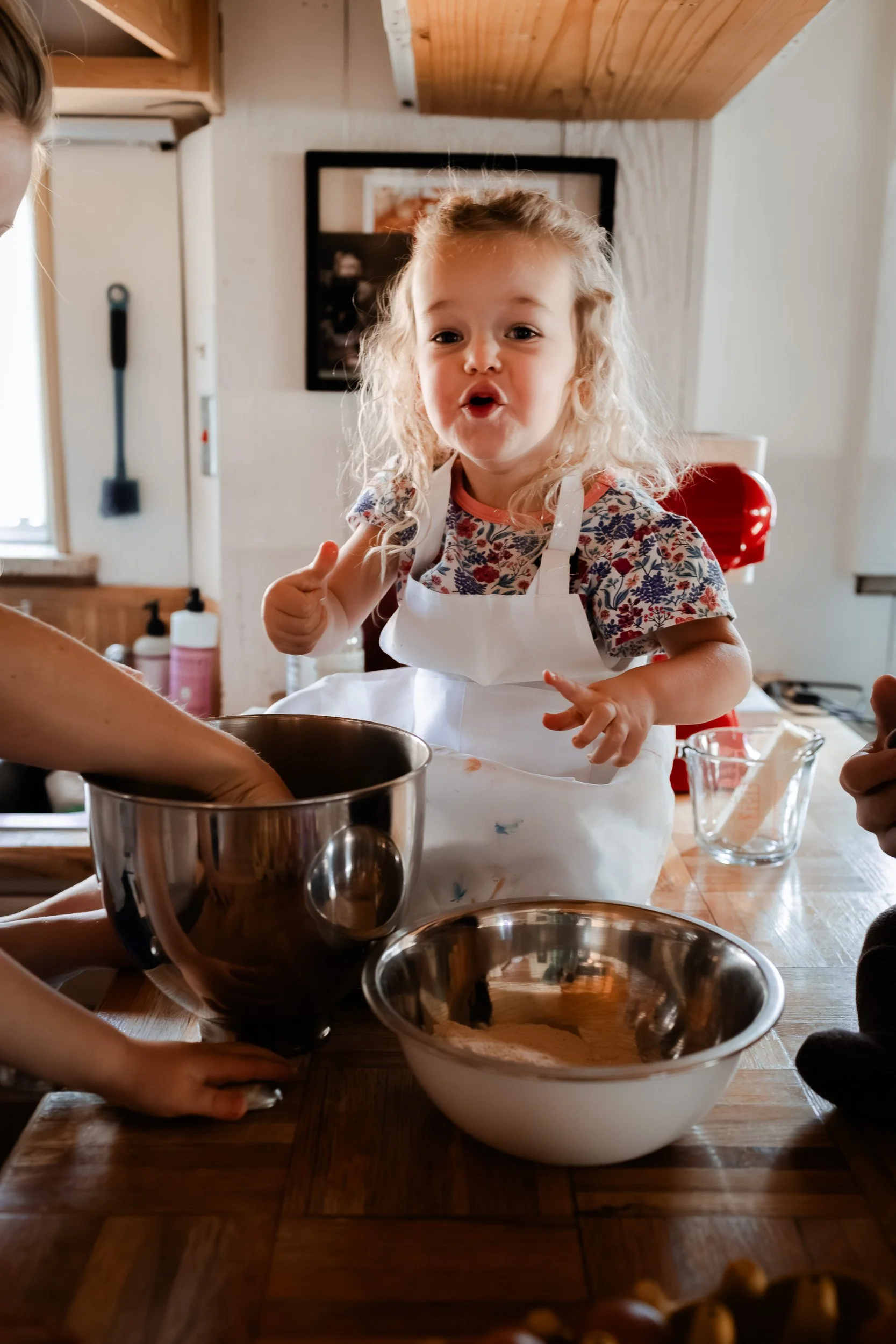 Family of five baking cookies together in their Boulder home during an indoor lifestyle photo session