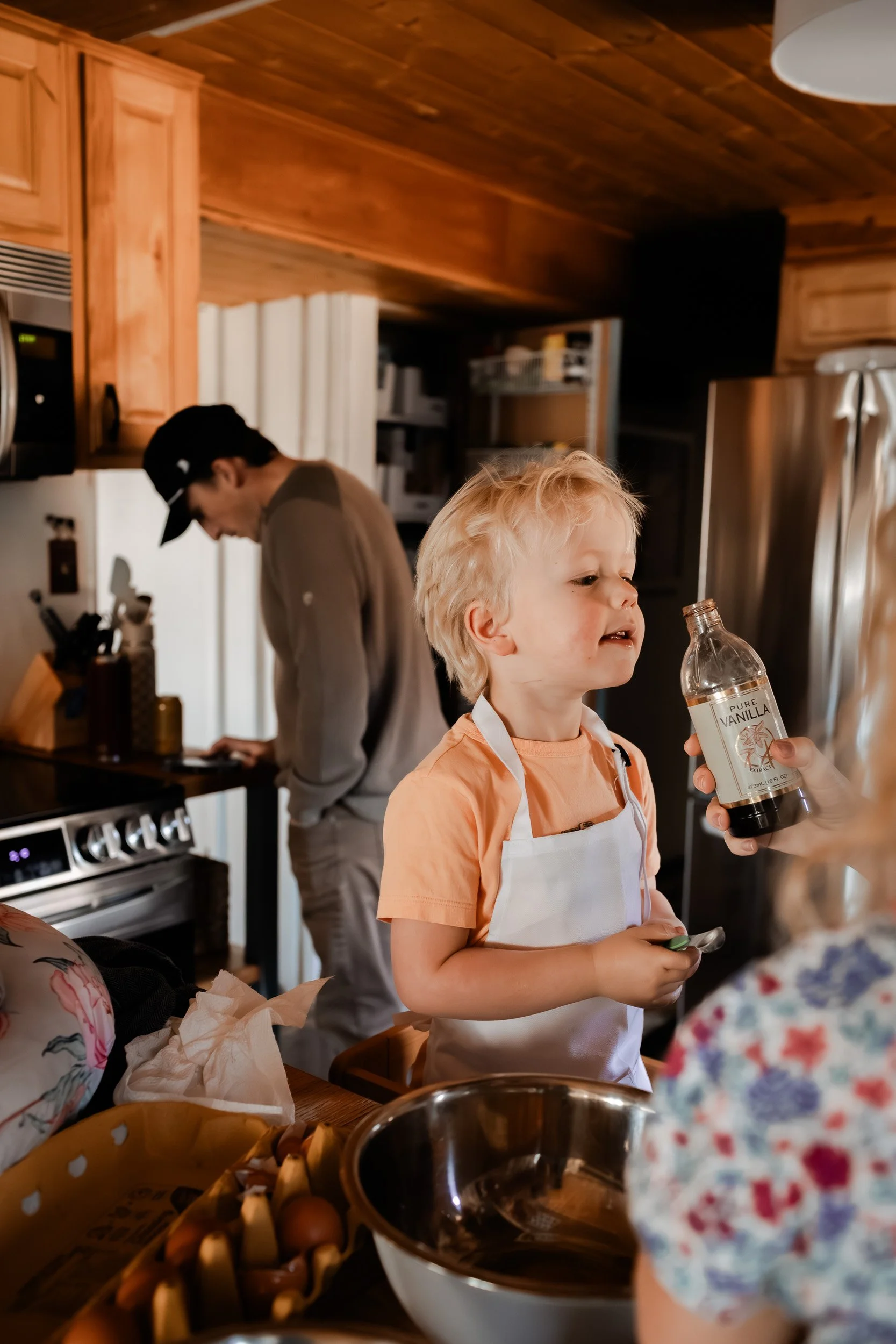 Family of five baking cookies together in their Boulder home during an indoor lifestyle photo session