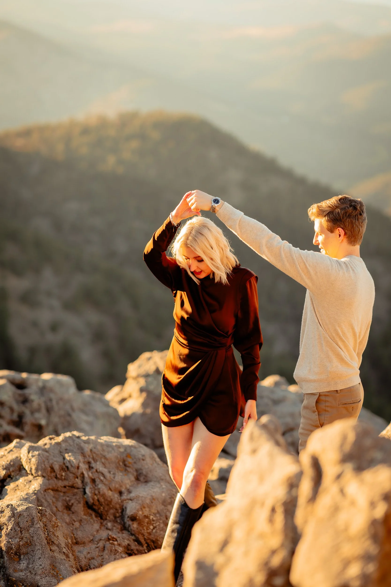 Ari and Andrew posing with mountain views at Lost Gulch Overlook engagement session