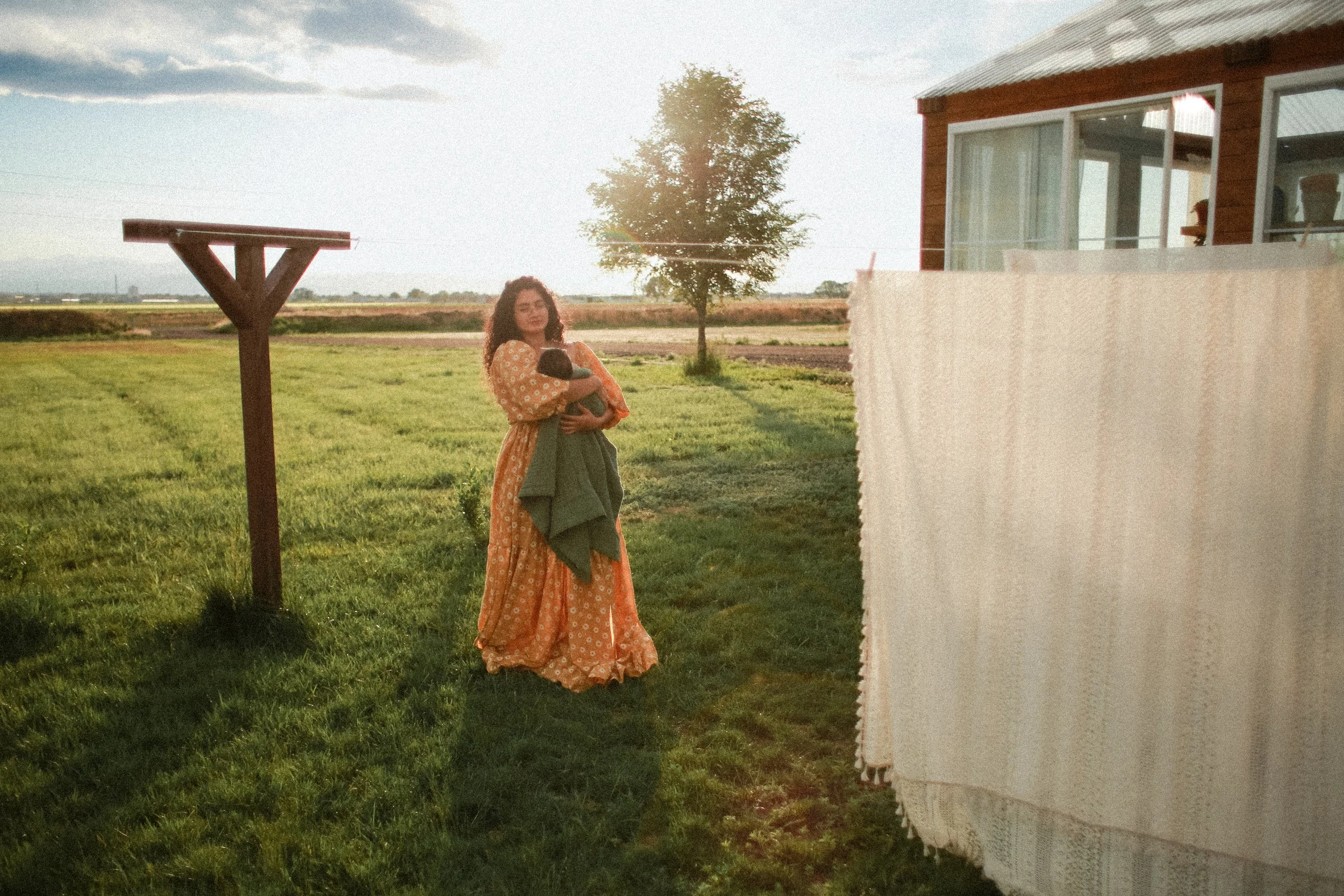 A whimsical family photoshoot at a charming greenhouse in Windsor, CO, during golden hour. This session beautifully blended warm, glowing light with lush greenery, capturing tender connections and playful moments—ideal for families who love unique, n