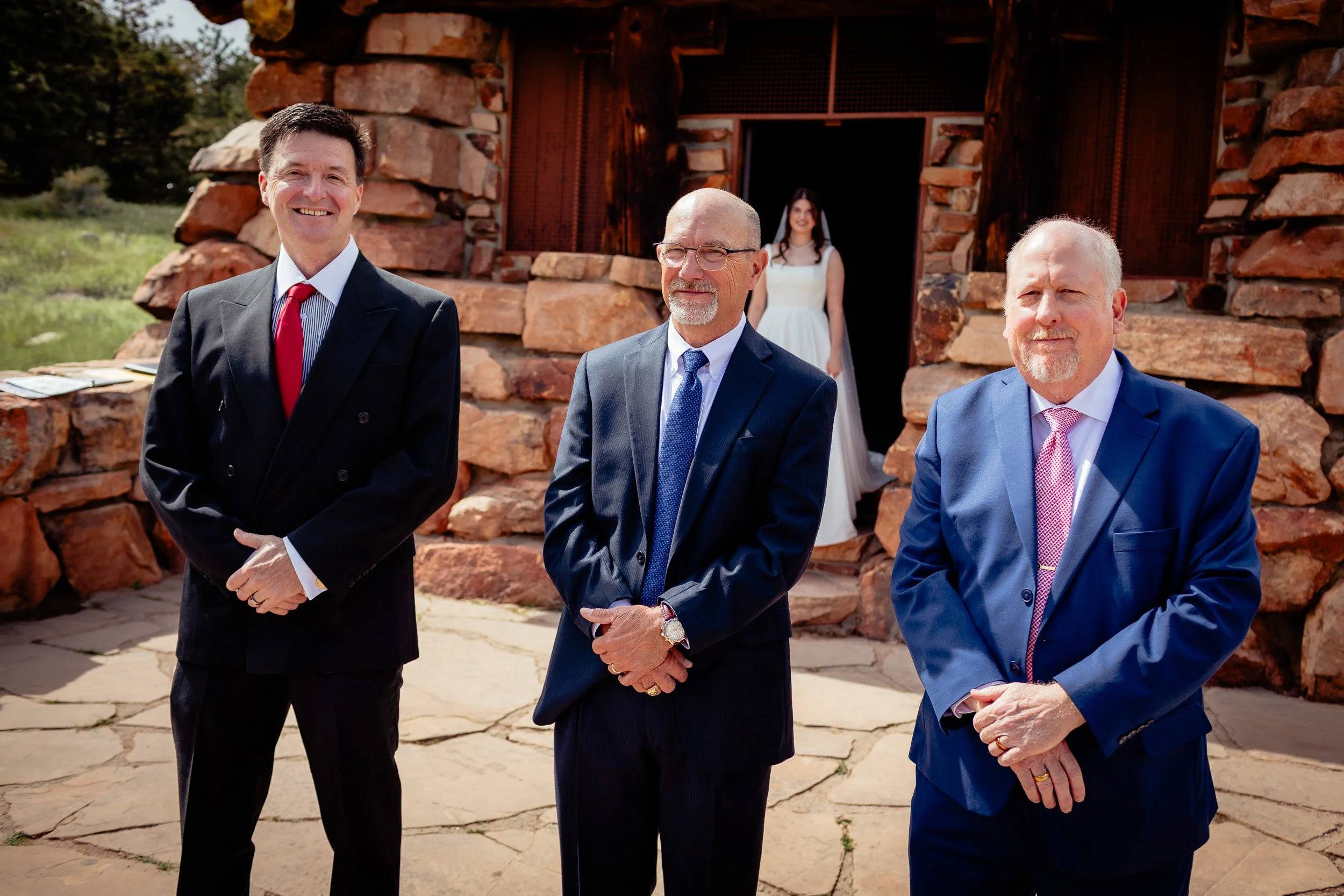 Bride showing her wedding dress to her parents before the ceremony