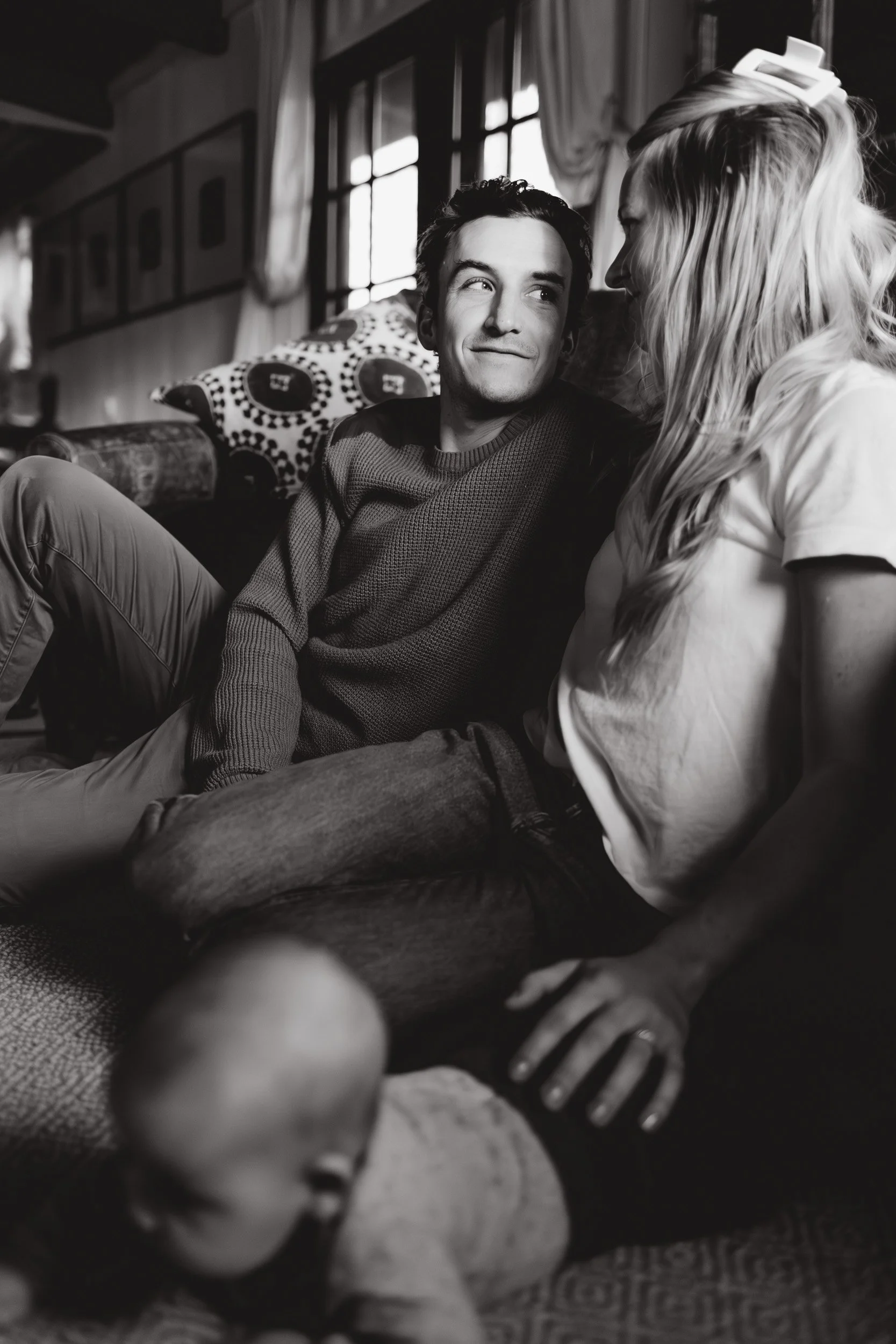 mother and father sharing a sweet moment as a couple in their boulder, co home