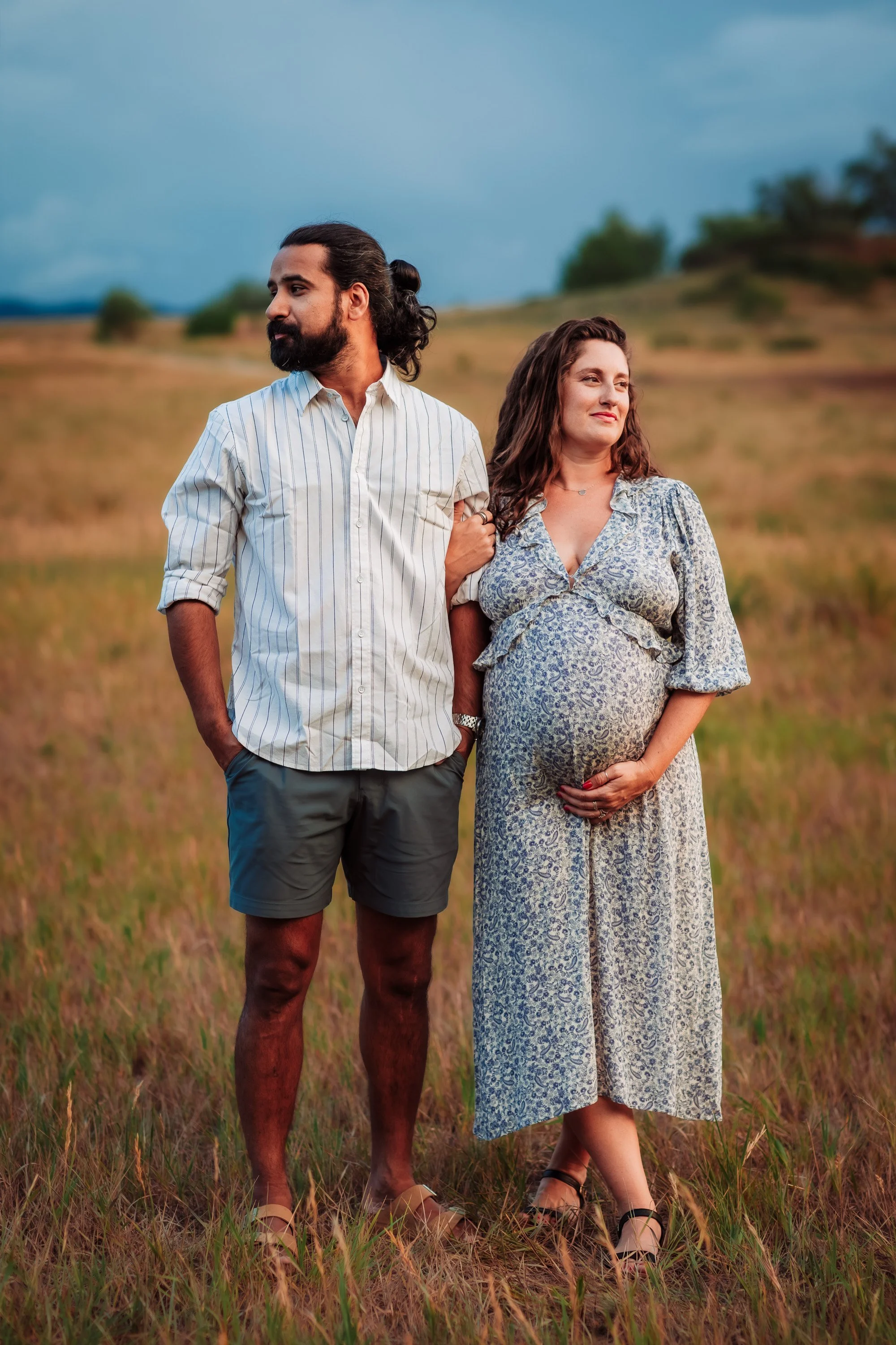 Family maternity photos in Boulder with a summer rainstorm in the distance