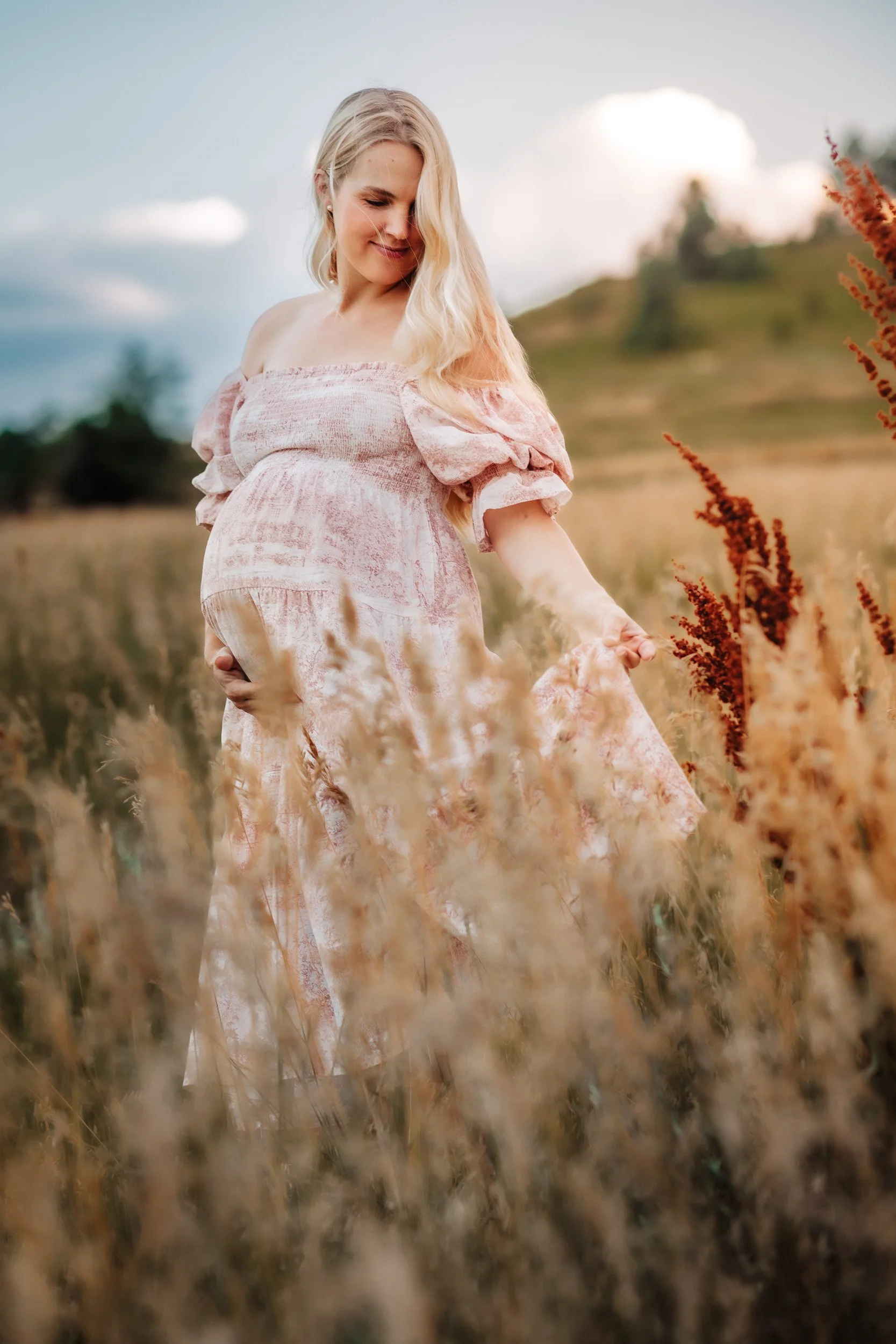 Expecting mother in a flowy summer dress