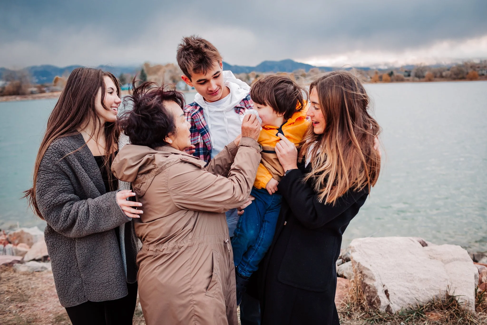 Extended family standing together at Waneka Lake in Lafayette, Colorado during a Thanksgiving lifestyle session