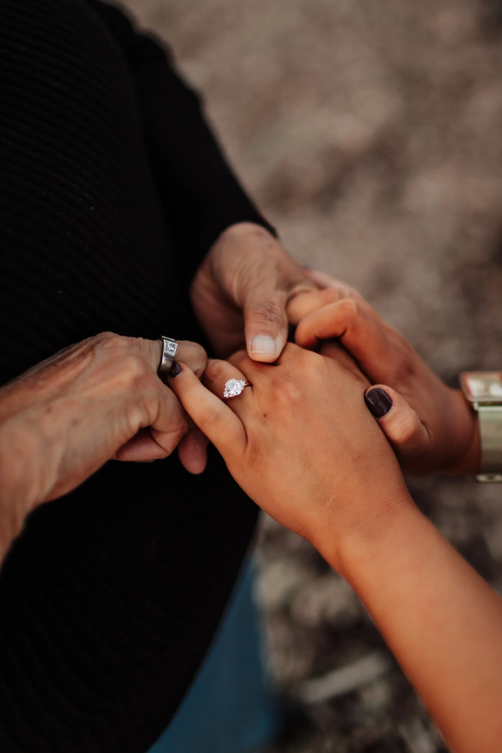 Close up of engagement ring after proposal in Lafayette, CO at Acreage Brewery