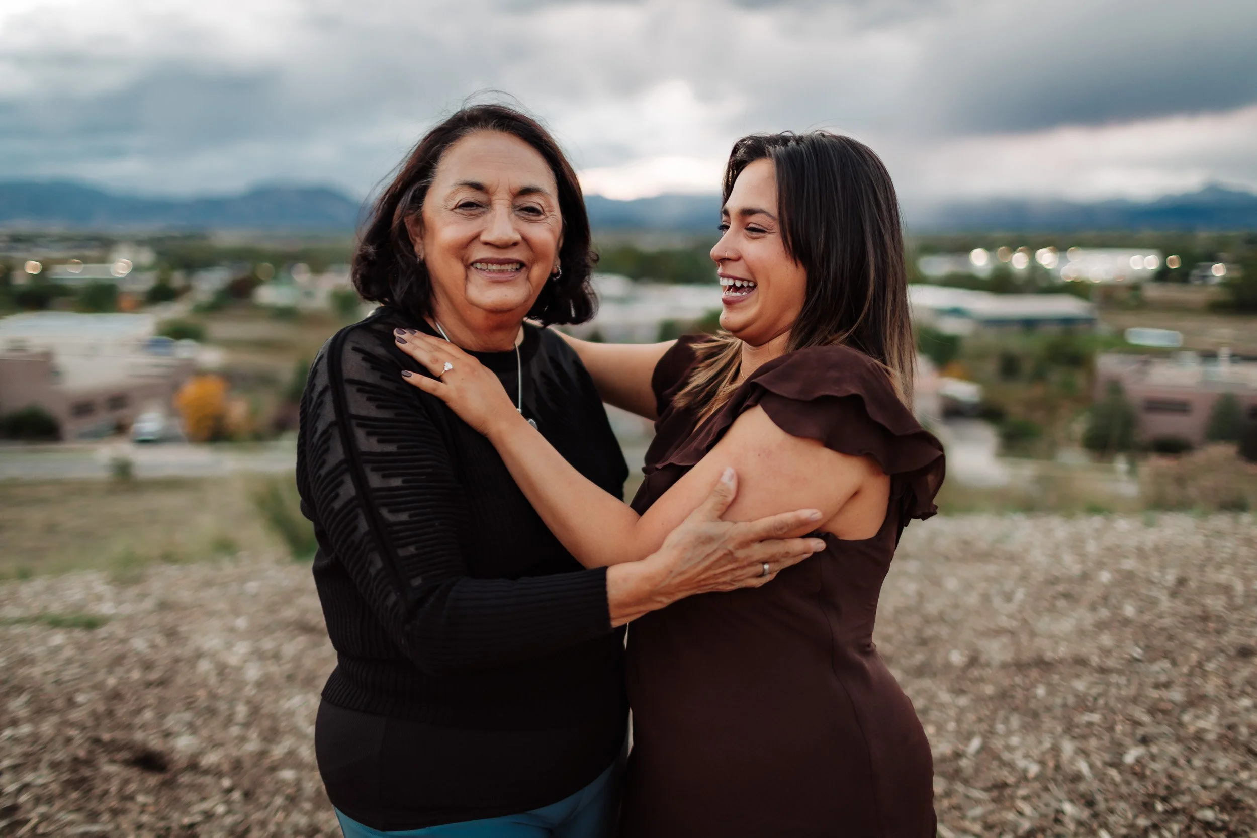 Joyful engagement reaction surrounded by family and friends