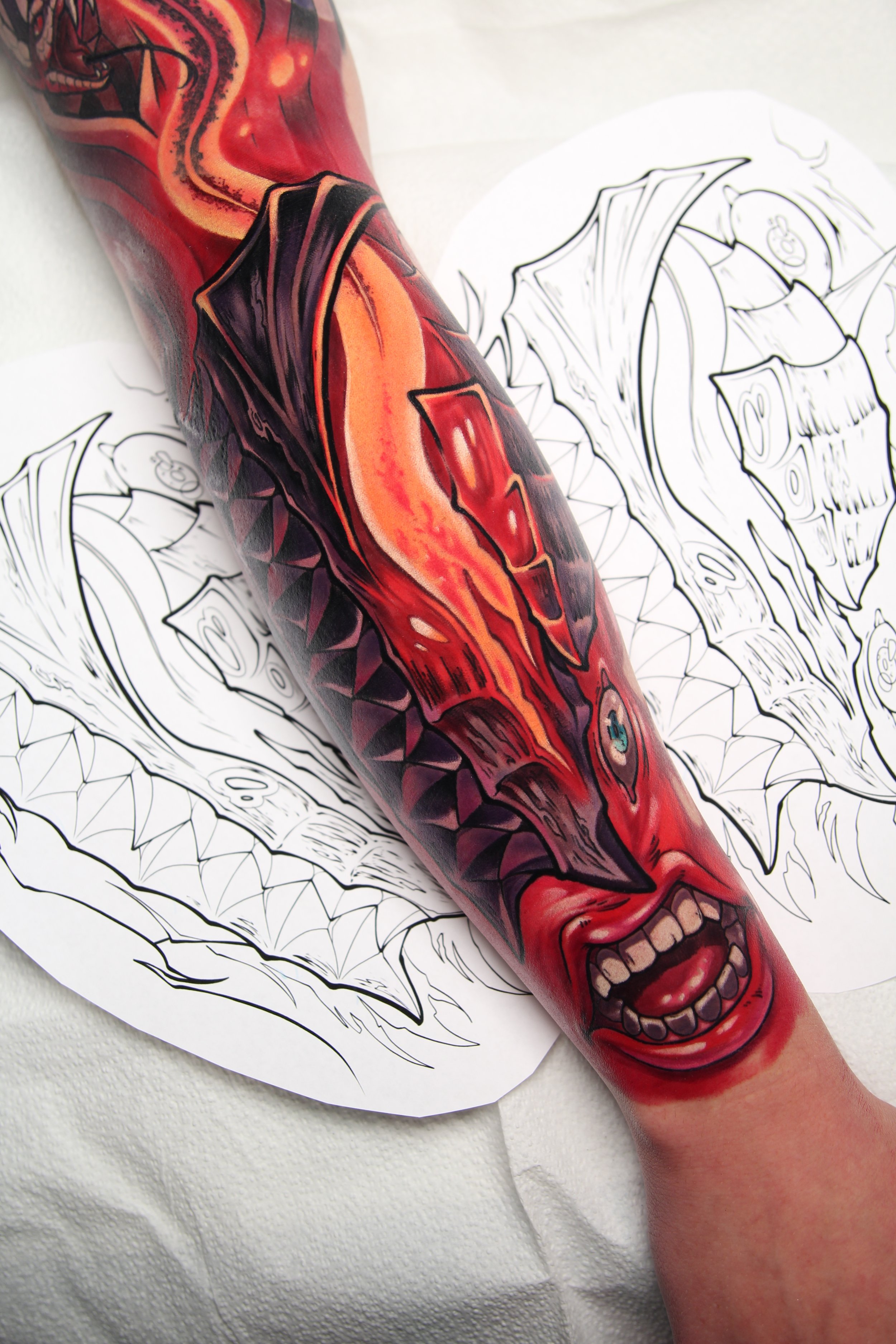 Beserk Tattoo - Anime tattoo of Berserk armor and the Behelit from Berserk by Tattoo Artist Ren Behan in Orlando, Florida.