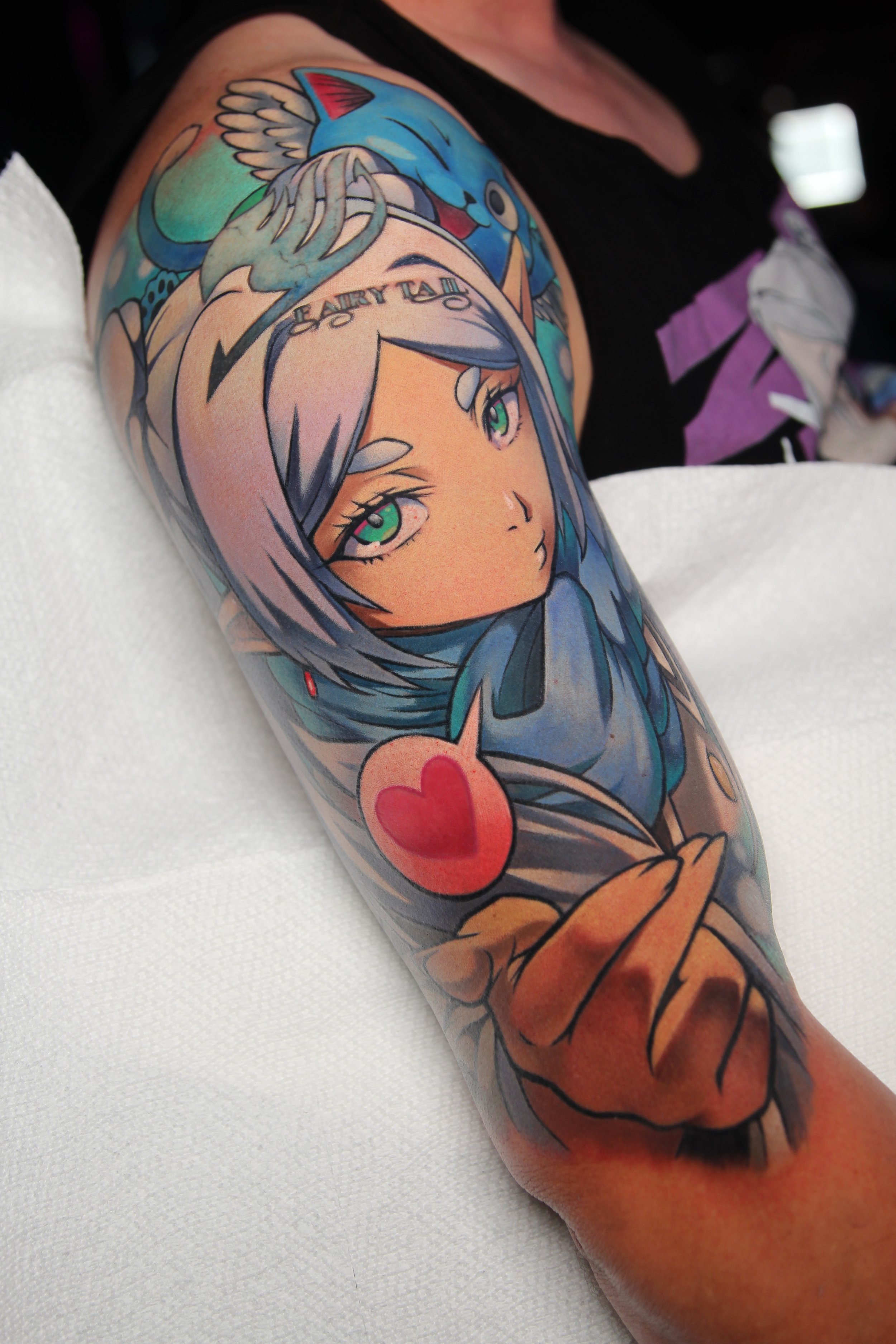 Frieren Tattoo - Anime tattoo of Frieren from Frieren: A Journey's End and Happy from Fairy Tail by Tattoo Artist Ren Behan in Orlando, Florida.