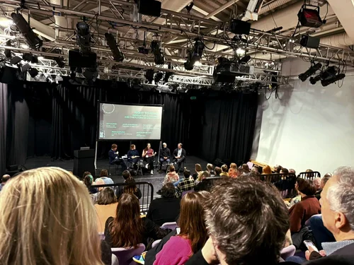 The Right to Remix panel at BEYOND Conference: five panellists seated on stage under a lighting rig, with the panel title on a screen behind them and an audience in the foreground.