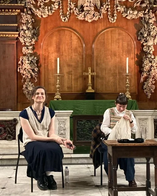 Two speakers seated in front of the ornate altar at St James's Church Piccadilly during Fact, fiction, faith: AI in an uncertain world, a conversation with Jocelyn Burnham and Dr Shauna Concannon, October 2024.