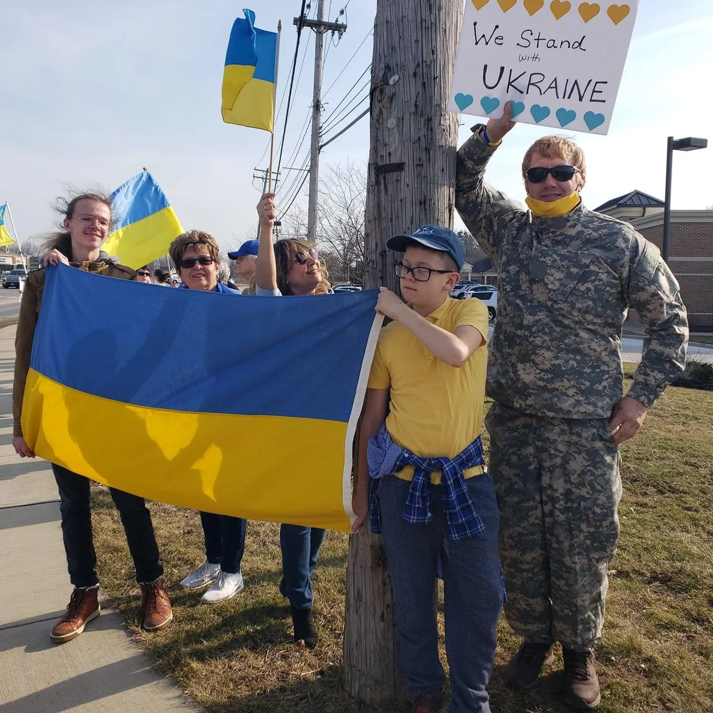 Protesters standing on a street corner