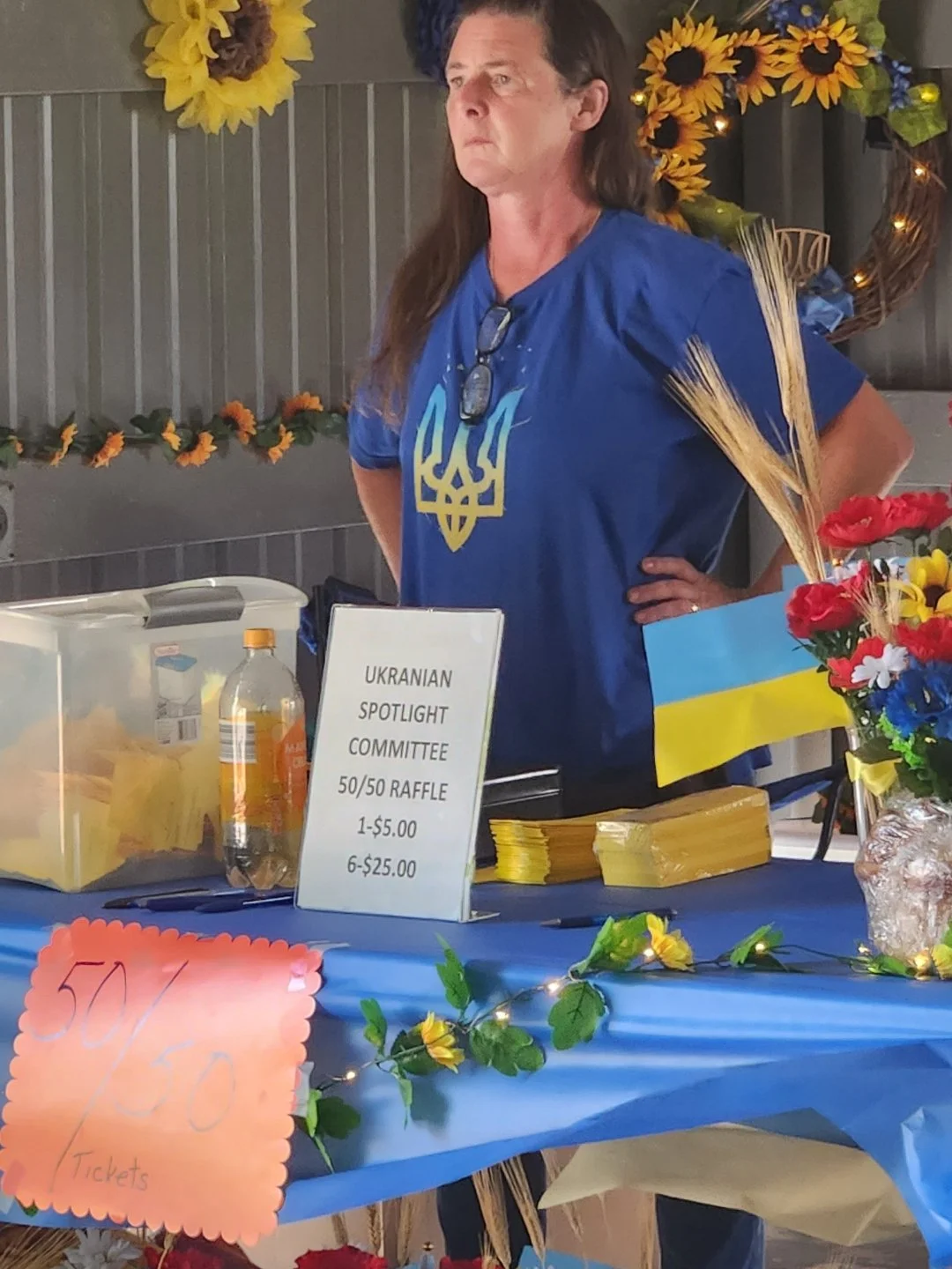 Woman standing at raffle booth