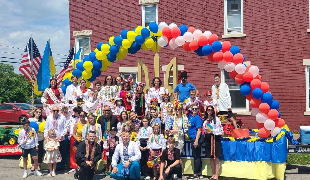Large group of people standing on a Ukrainian-themed float