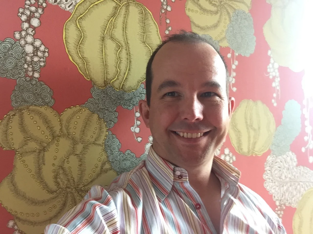 Man smiling with colorful background