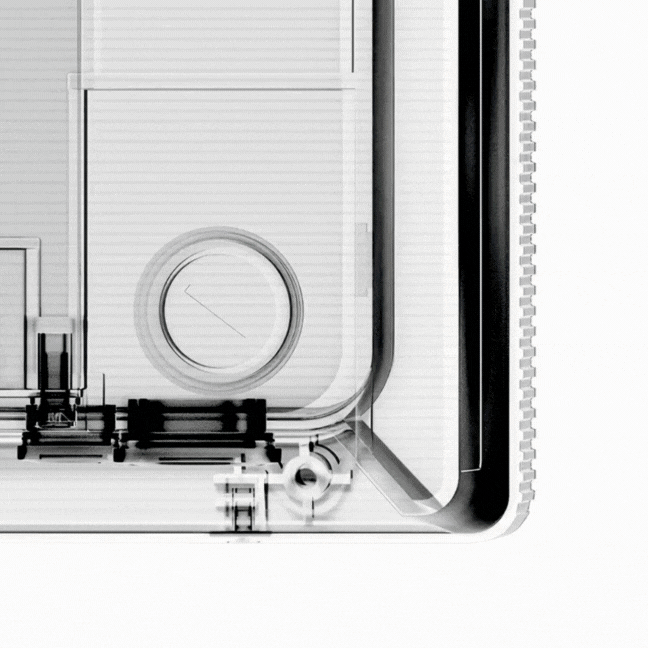 Close-up of a transparent electronic or mechanical device with visible internal components and a circular dial.