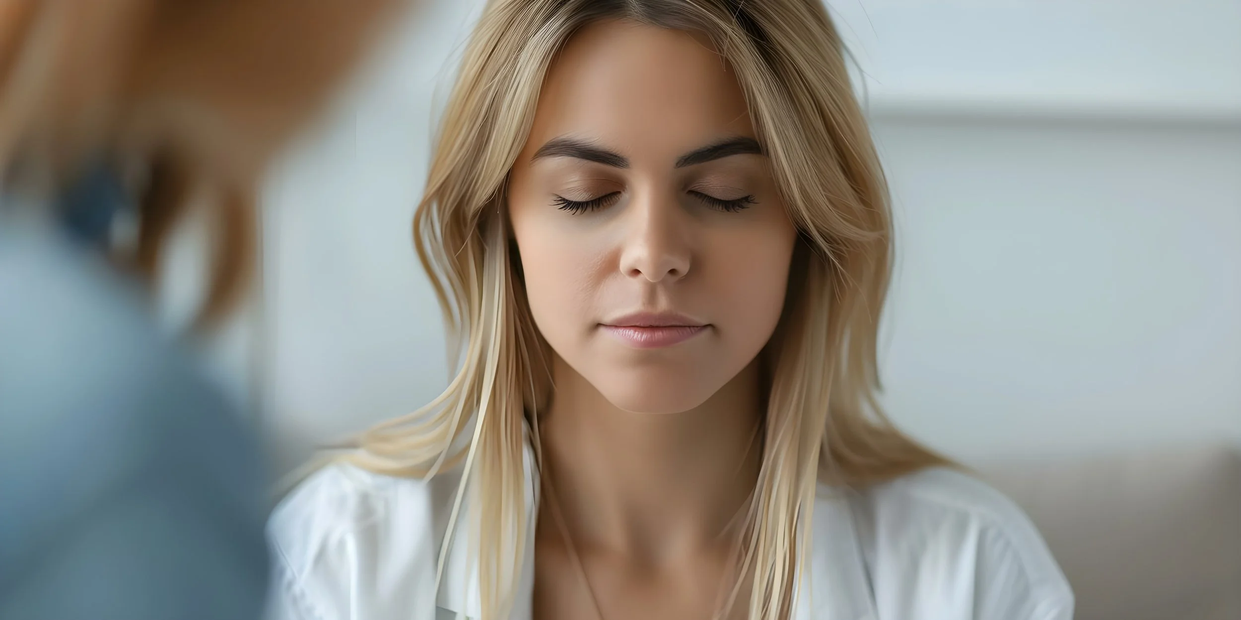 Close-up of woman practicing mindfulness or grounding skills to manage anxiety and overwhelm.