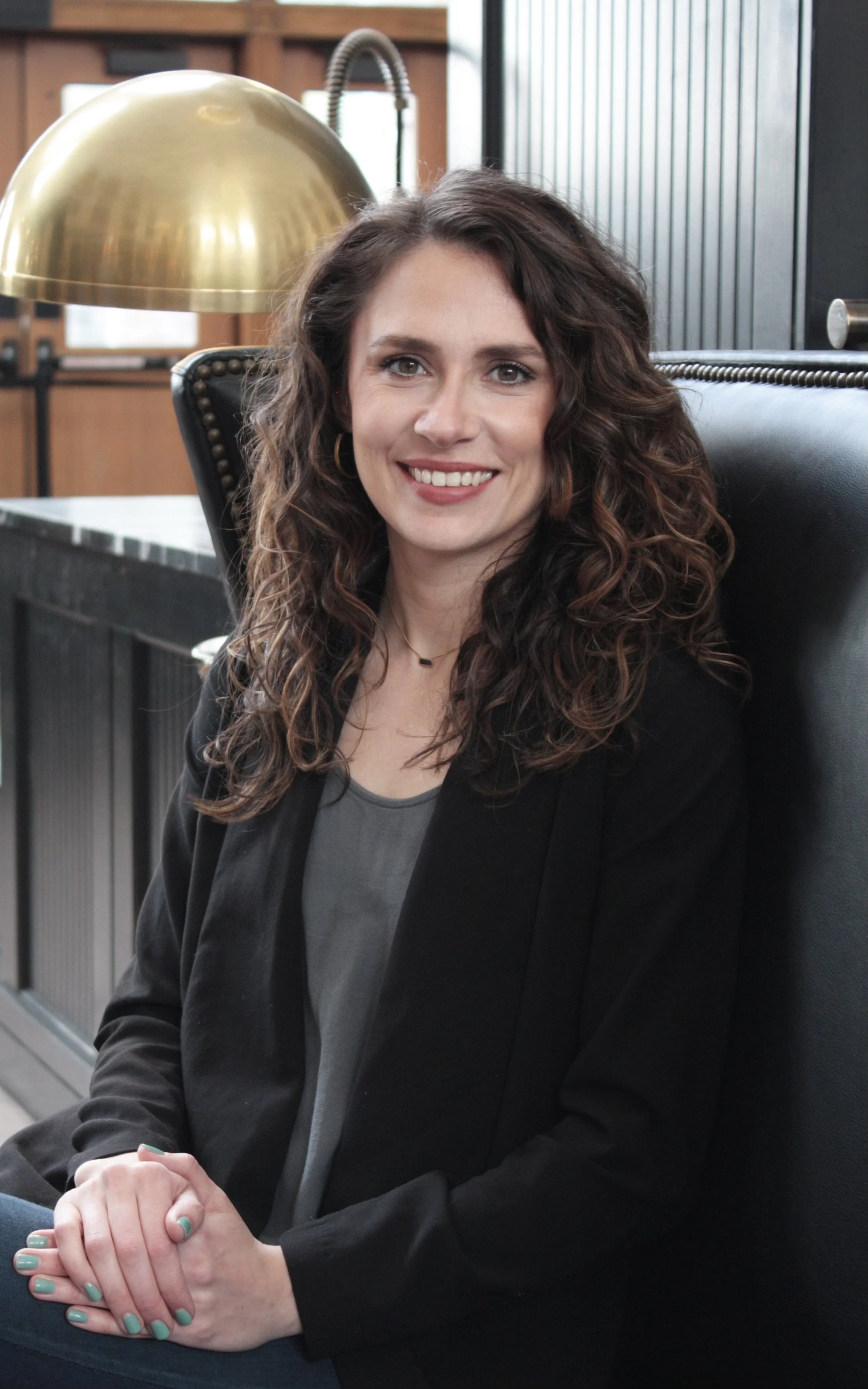 Therapist creating a grounding, welcoming space for client to explore healing.