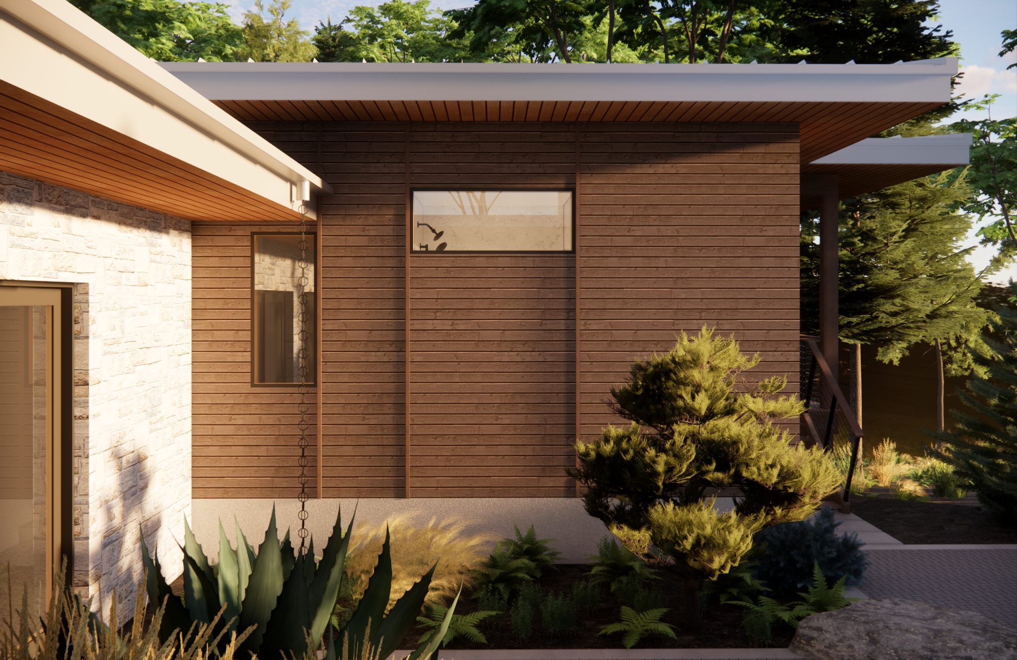 Close-up of a modern house exterior with brown wooden siding, beige stone wall, and large windows surrounded by green shrubs and trees.