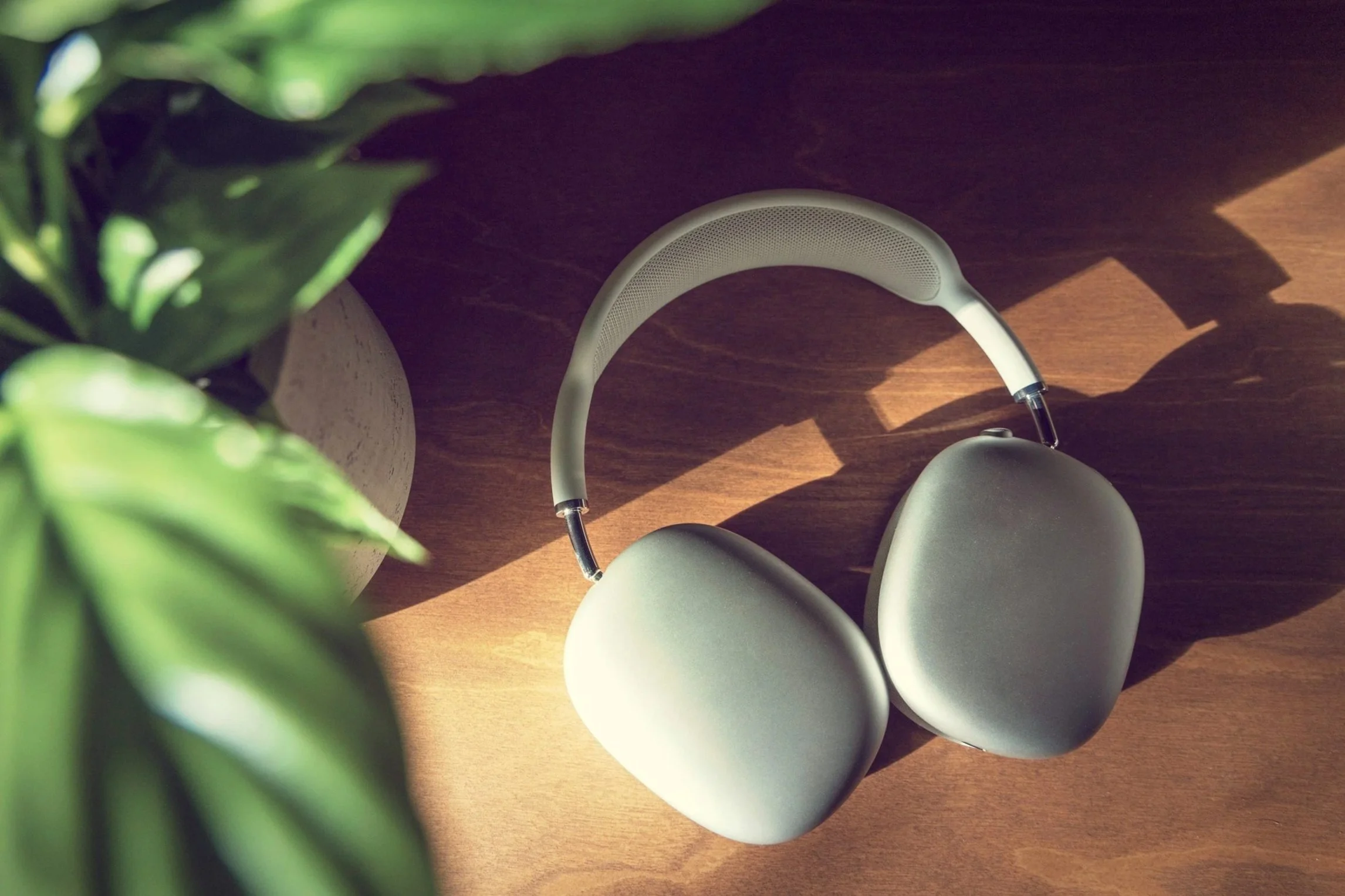 Over the ear head phones on a brown desk