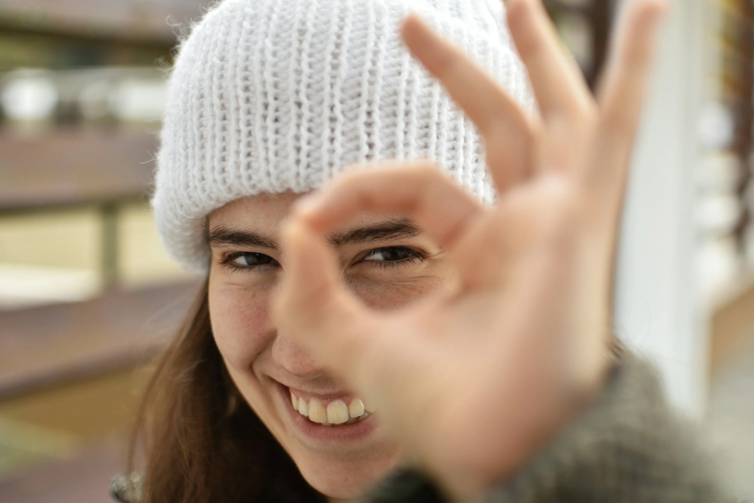 A partial view of a woman's smiling face