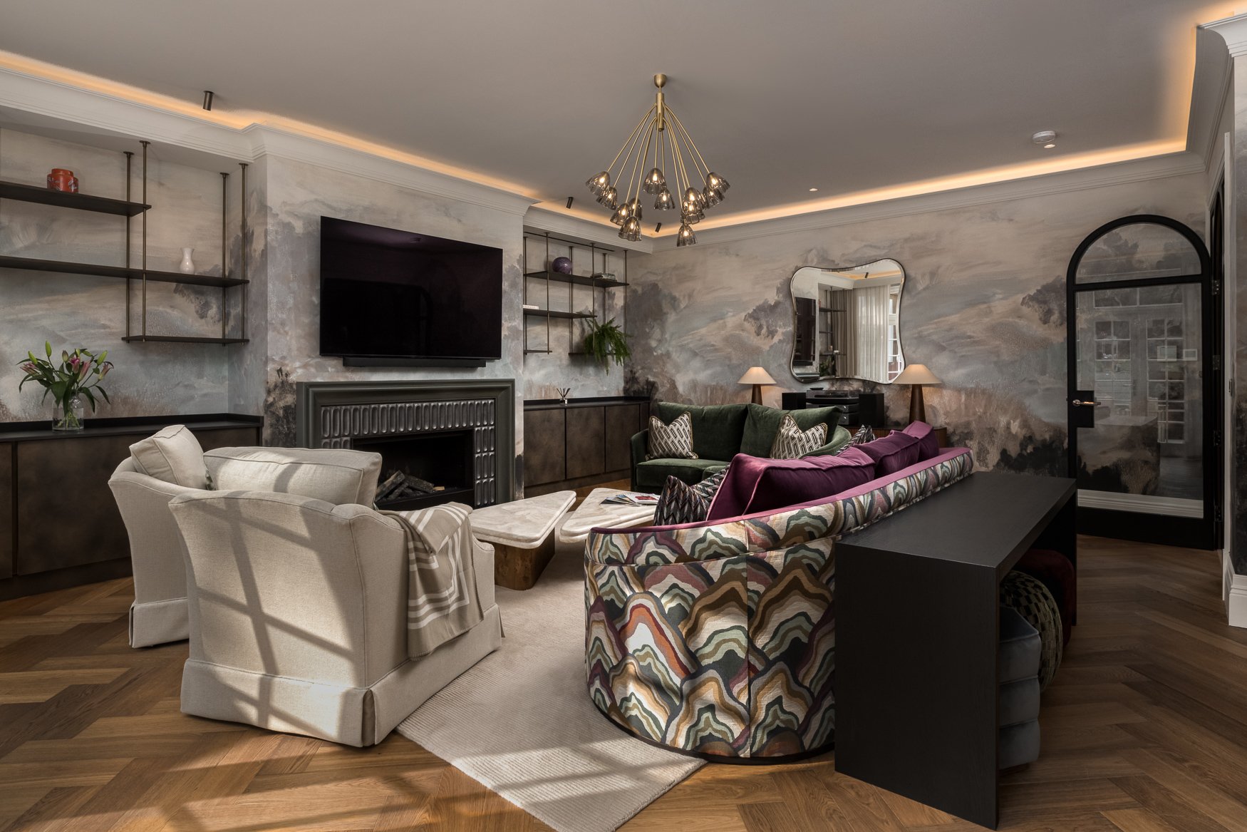 Statement lounge interior with rich colour, layered textiles and warm residential lighting.