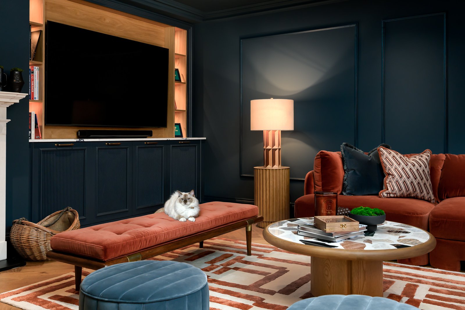 Dark lounge interior at Newlands by Rebecca Sudic Interiors, photographed to show colour, atmosphere, furniture, lighting and lived-in detail.