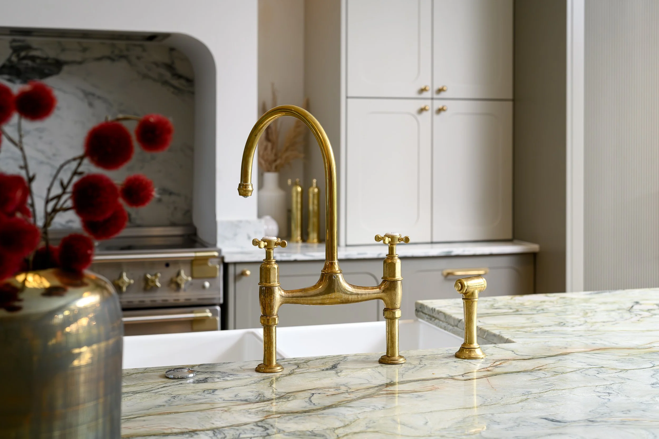 golden, vintage tap in  the kitchen. Design detail
